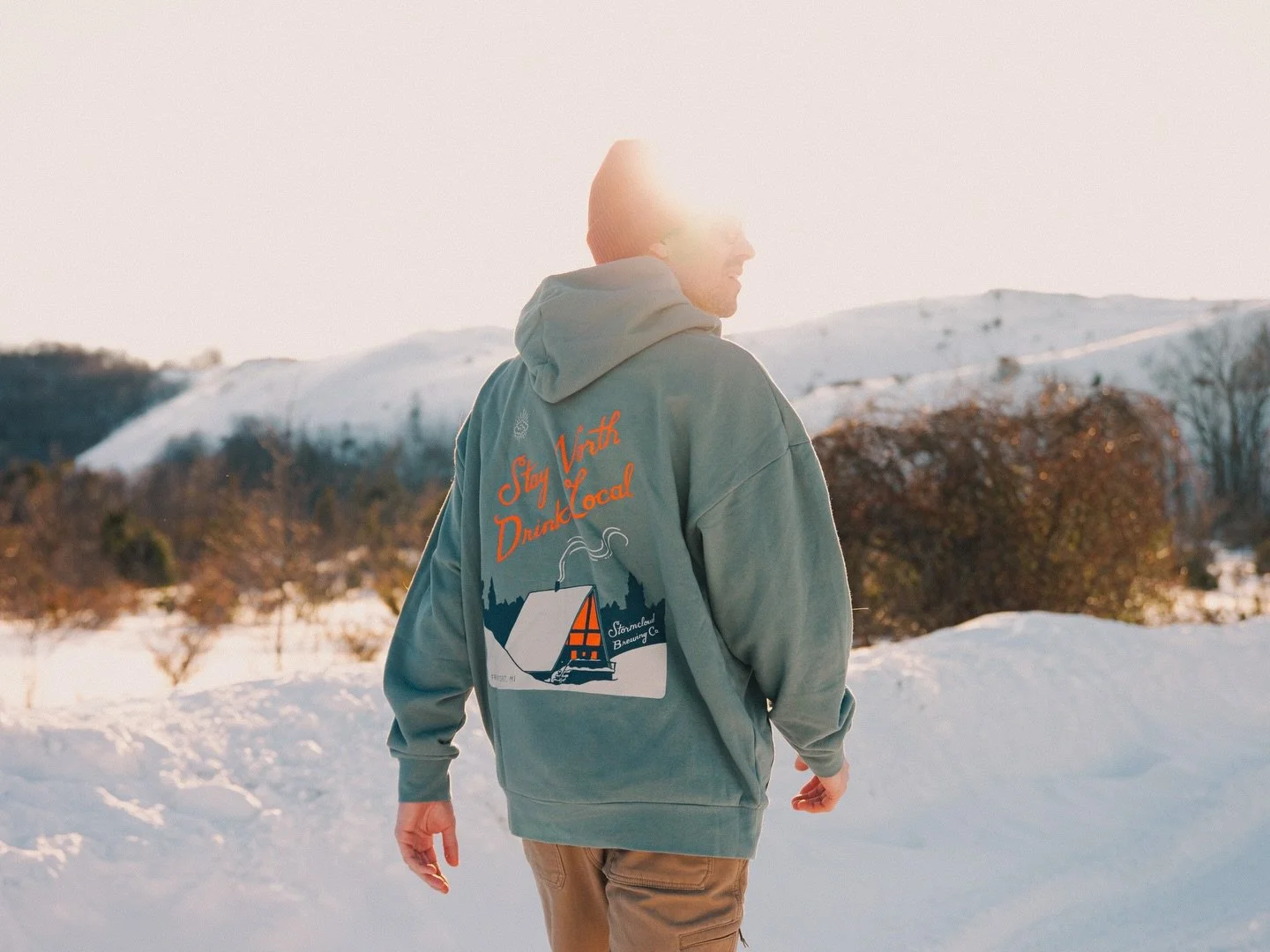 We created the Stay North Hoodie for the folks who stay when the birds fly south and the summer crowds thin out. Those who dig out their cars, brave the lake-effect snow, and still show up at the pub for a pint during the cold season. This winter has
