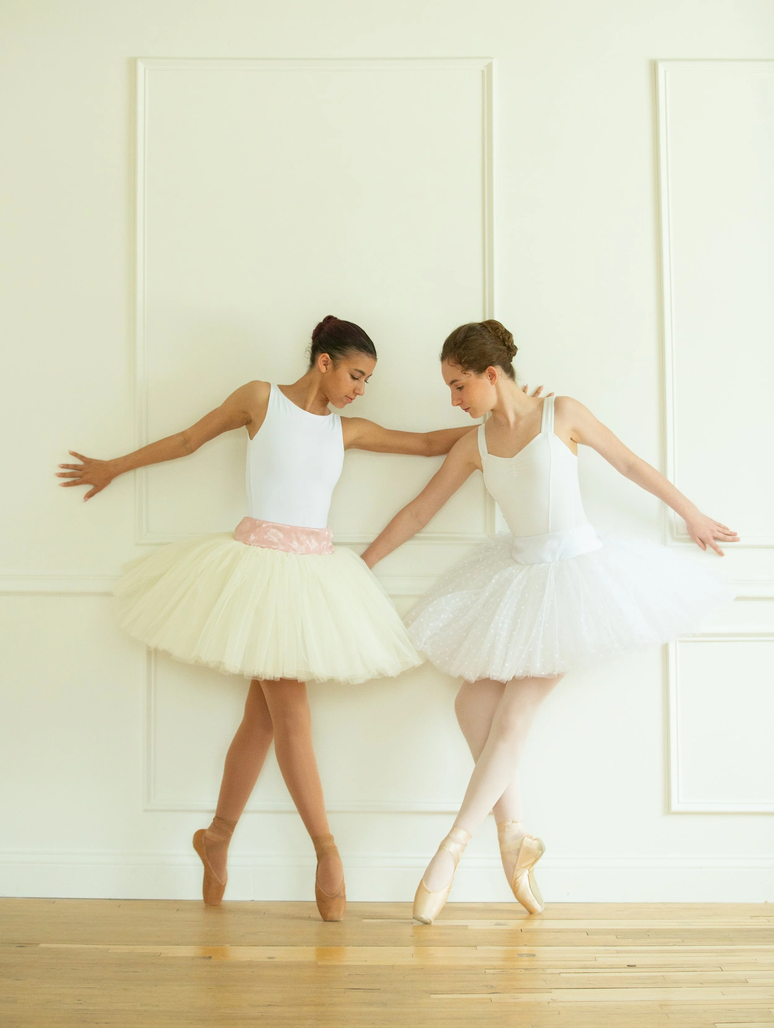 Two models posing in a more contemporary ballet fashion during the annual photo event. 