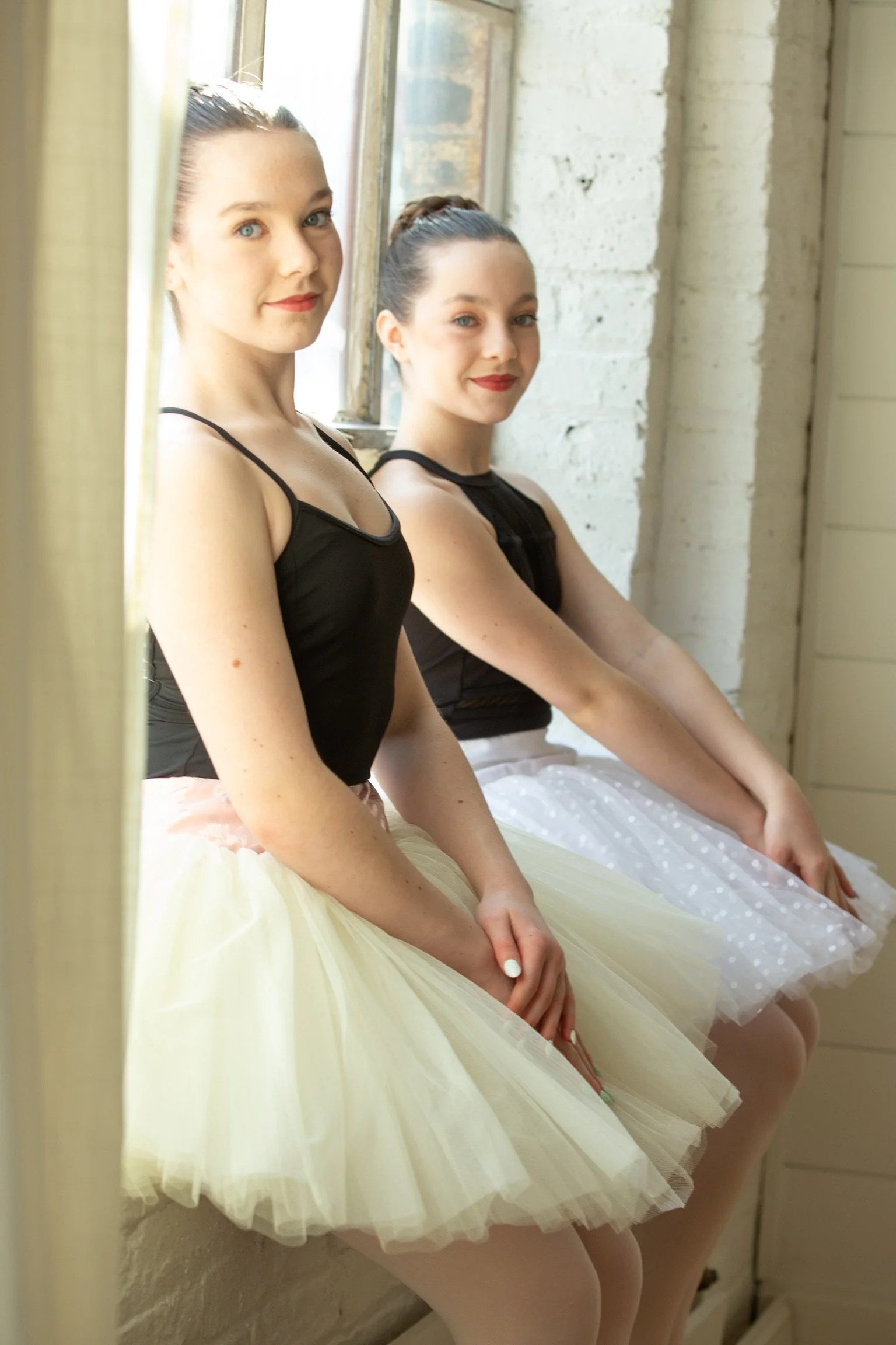 Le Chaton Tutu models posing in-studio wearing their fitted basque practuce tutus. 