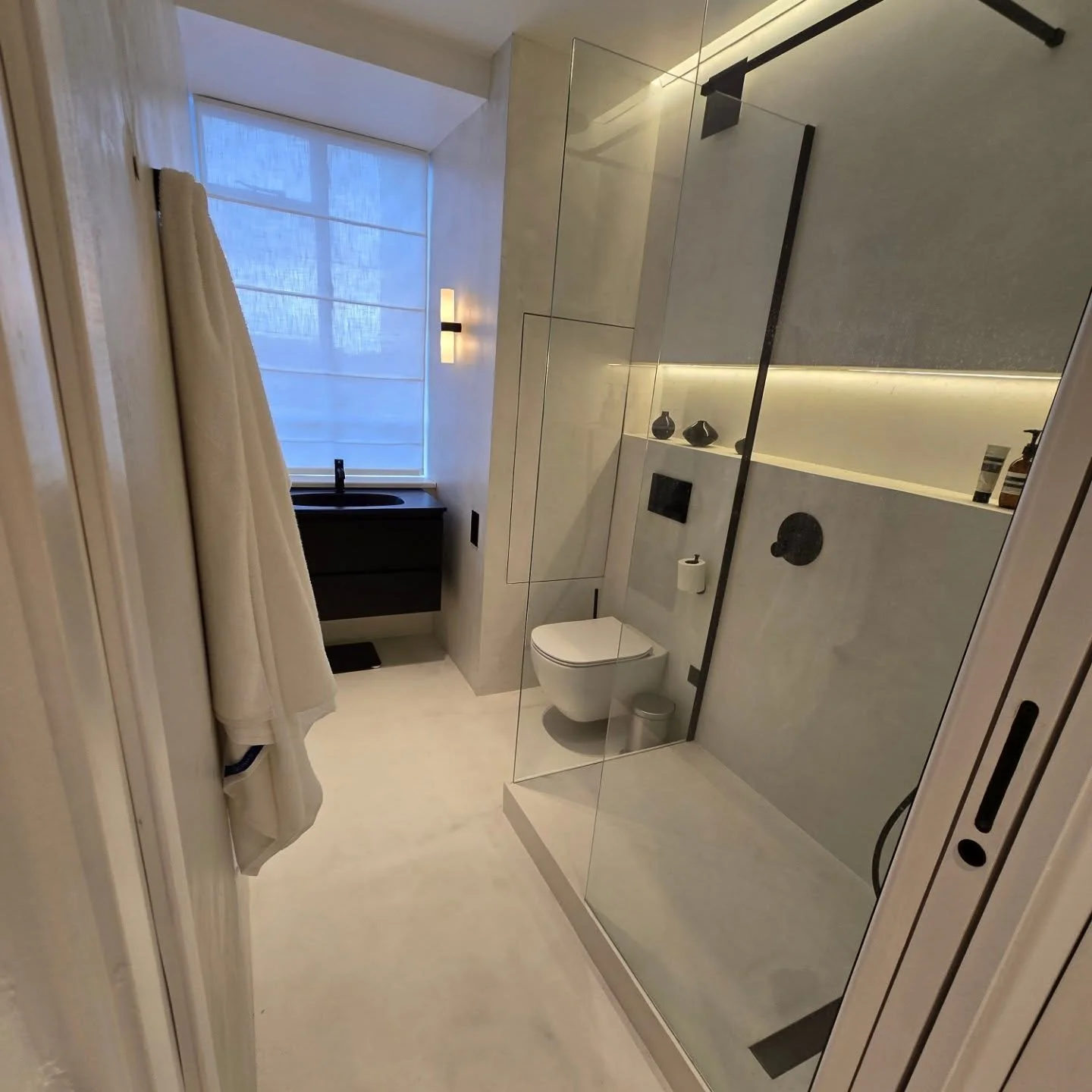 ✨ Modern Minimalism at Its Finest ✨

Step into this sleek, spa-like oasis, where every detail is designed for both luxury and functionality. This bathroom features a seamless microcement finish, creating a smooth, elegant, and easy-to-maintain surfac
