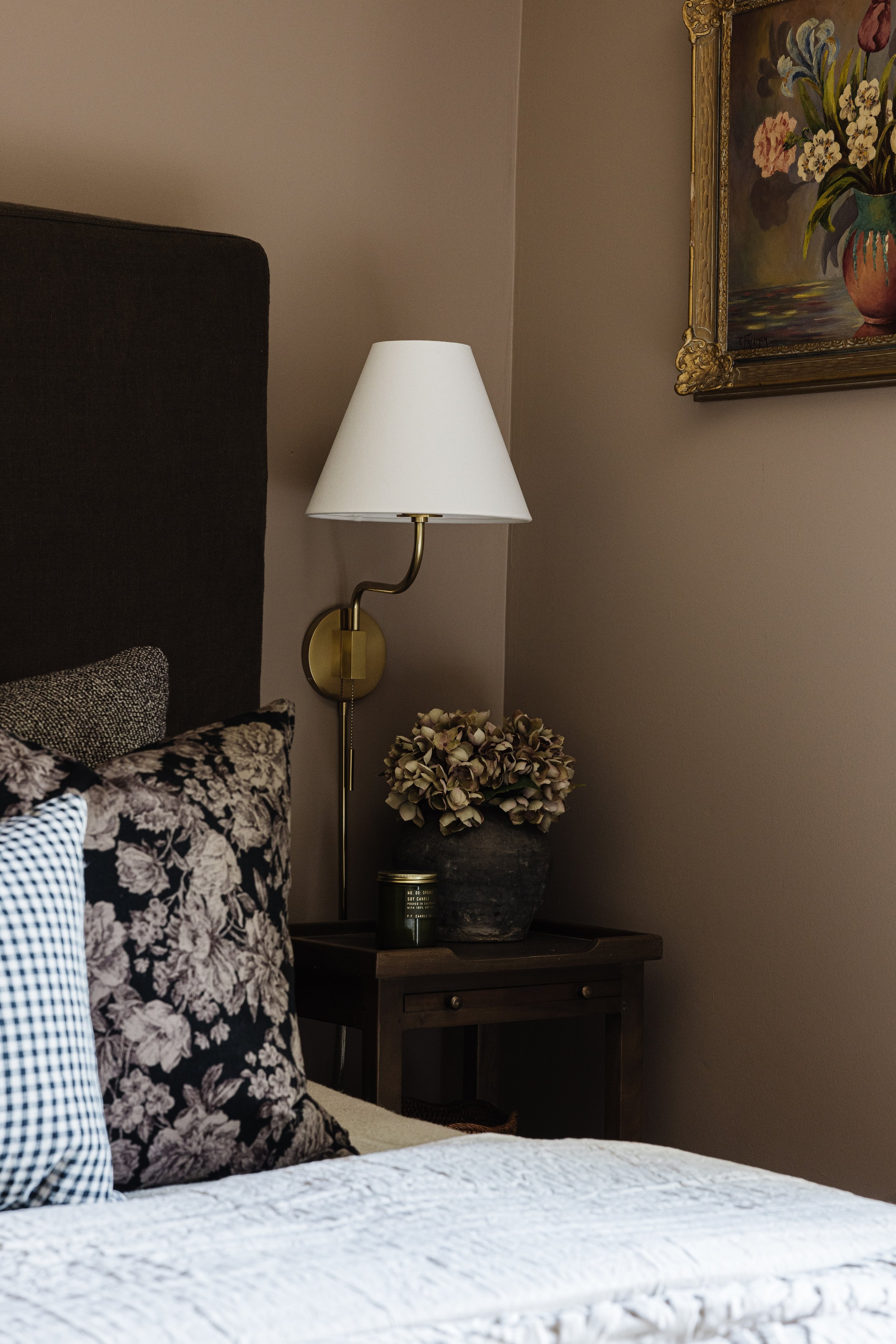 Collected, lived-in bedroom with mid-century details and soft florals