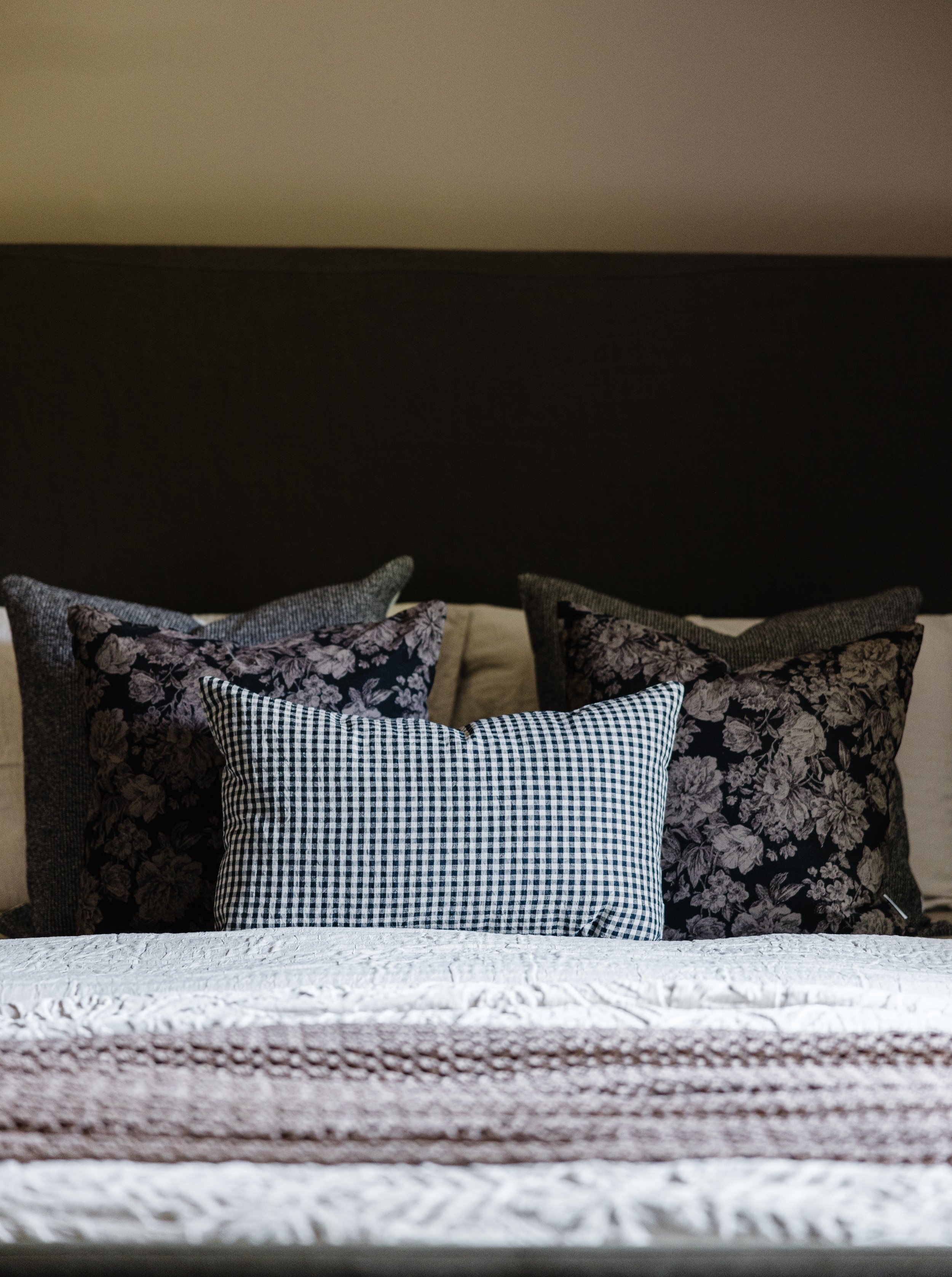 Collected, lived-in bedroom with mid-century details and soft florals