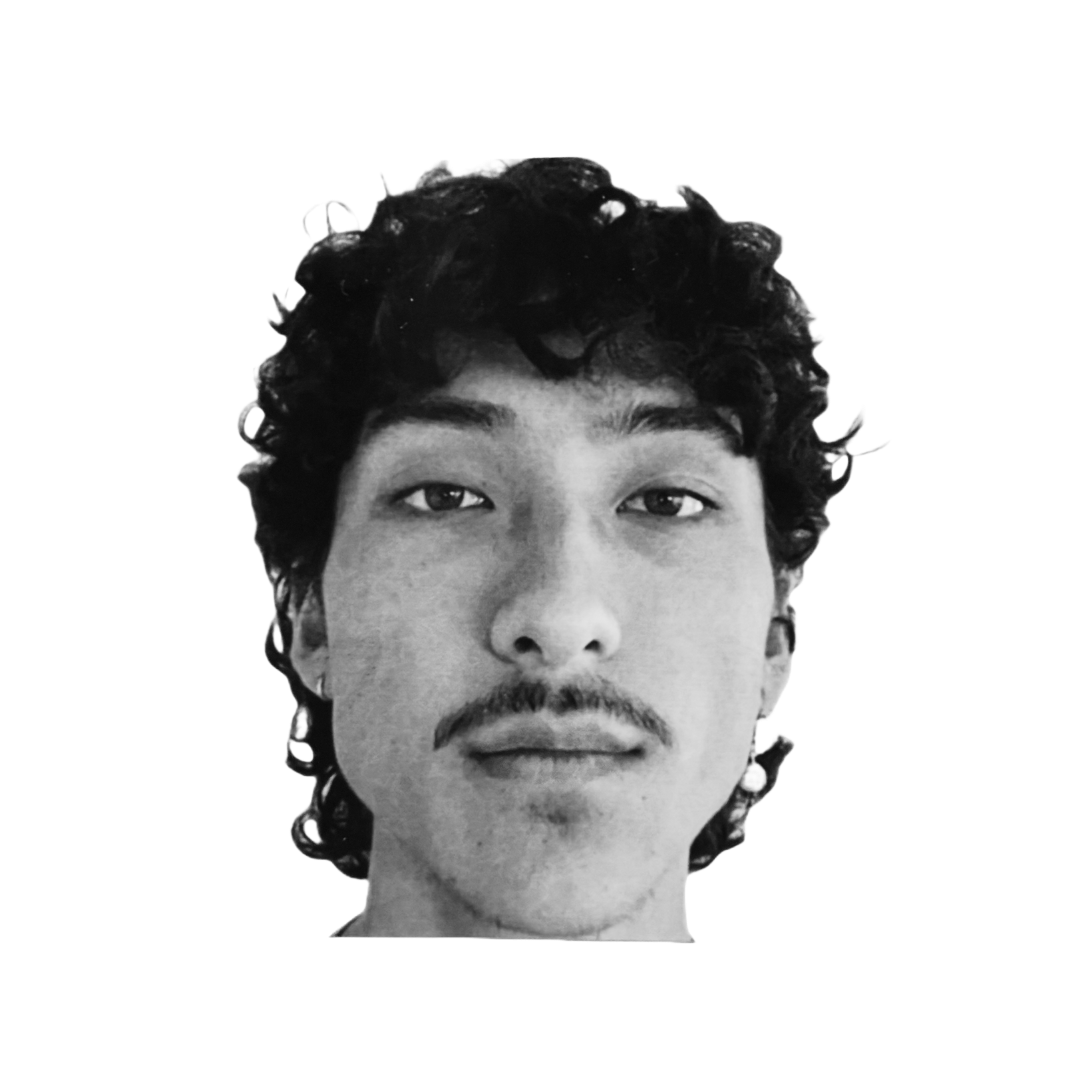 Close-up black and white photo of a man's face with curly hair, a mustache, and a calm expression.