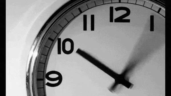 Close-up of an analog clock showing 10:08.