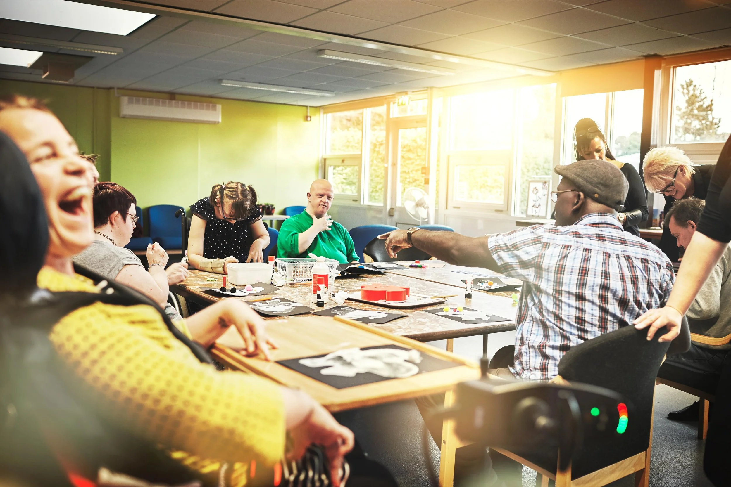 Adults participating in a community-based TBI rehab program focused on vocational therapy, skill-building, and purposeful daily routines.