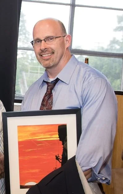 A vocational therapy professional smiling in a headshot.
