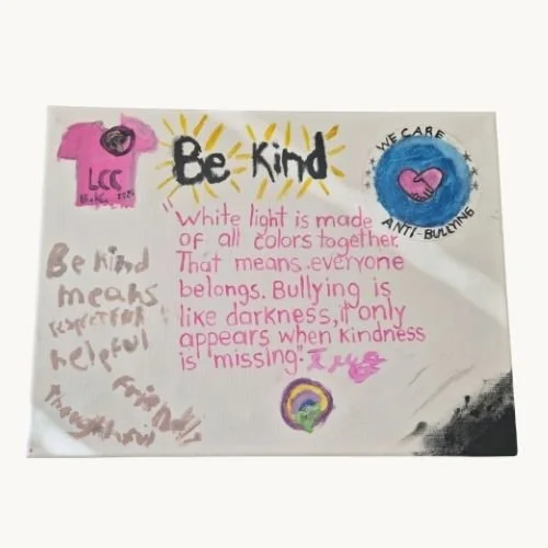 A youth created anti-bullying poster called "Be Kind" with a quote that says: "White light is made of all colors together. That means everyone belongs. Bullying is like darkness, it only appears when kindness is missing."
