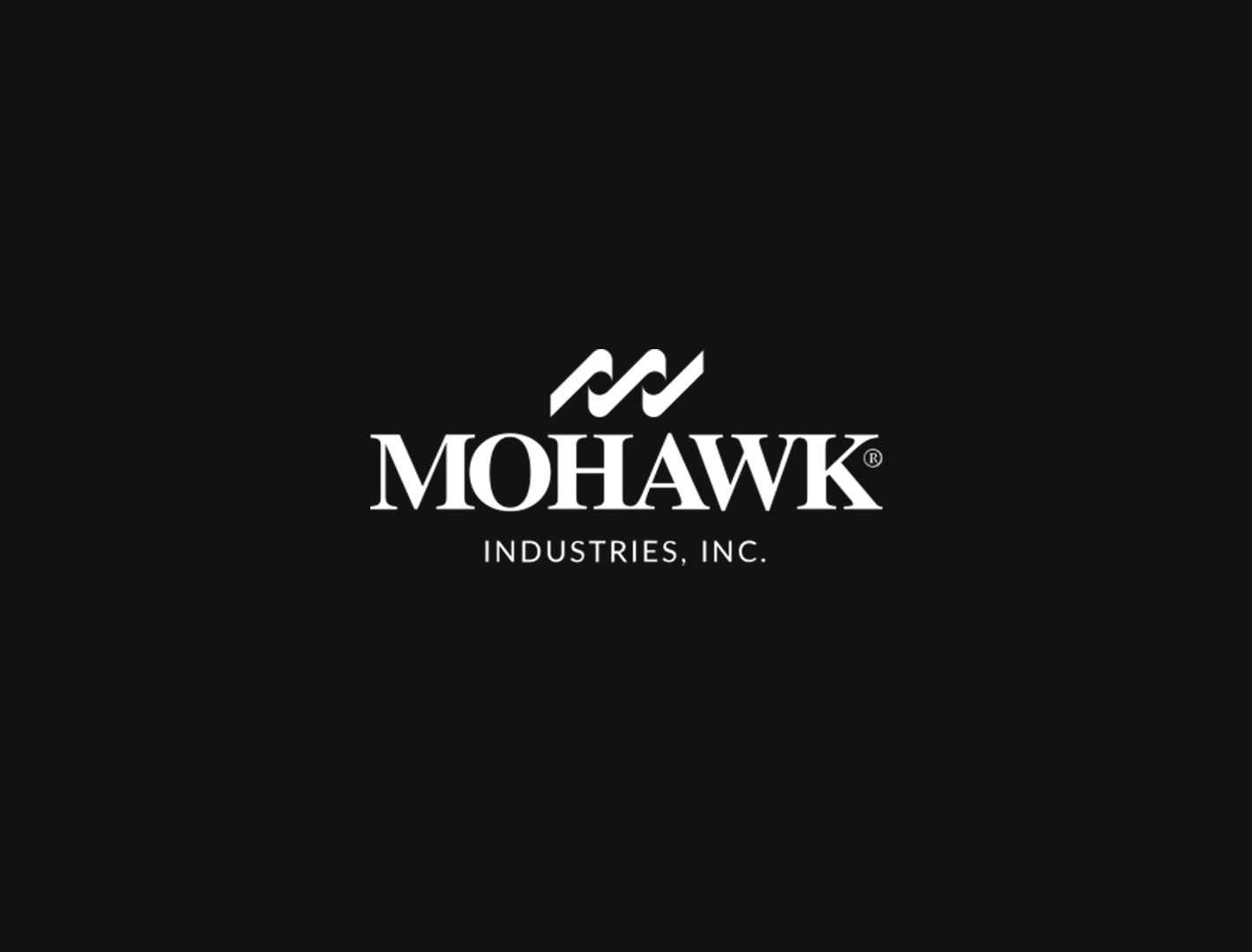 Black background with white logo and text reading "MOHAWK INDUSTRIES, INC." and a stylized eagle emblem above the company name.