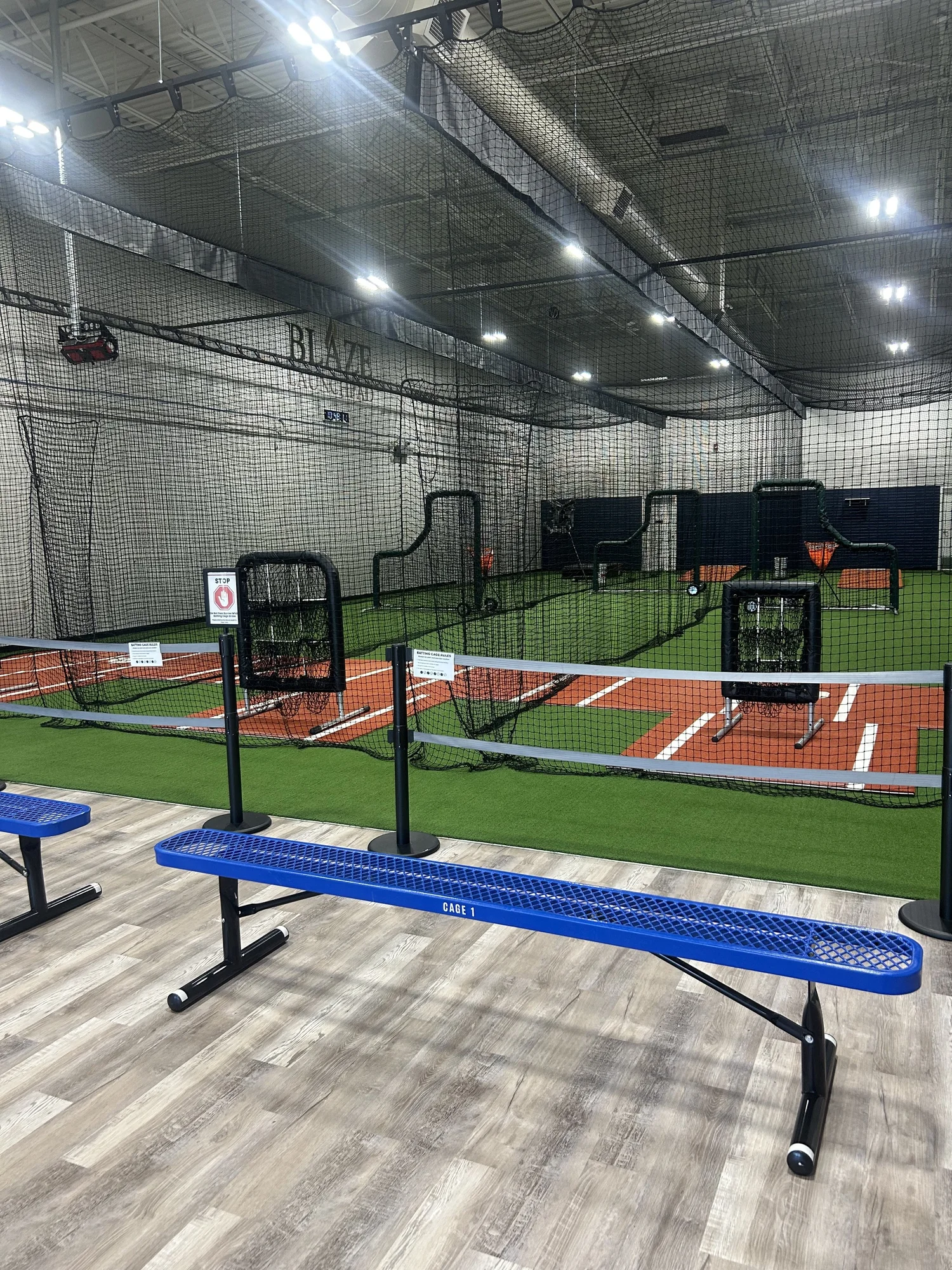 Indoor batting cages and seating at Blaze Launchpad