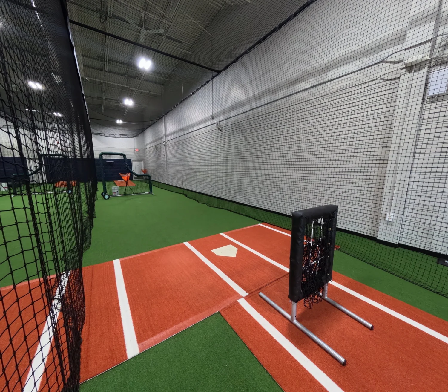 Full-length indoor batting cage at Blaze Launchpad