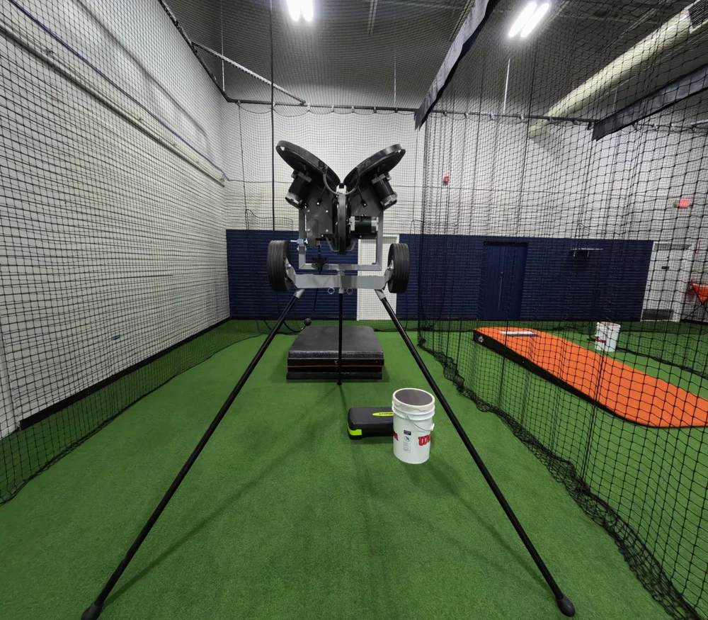 Pitching machine inside the Blaze Launchpad Premium Cage