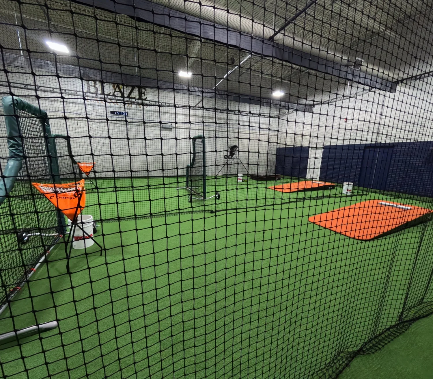 Open turf and batting cage space at Blaze Launchpad