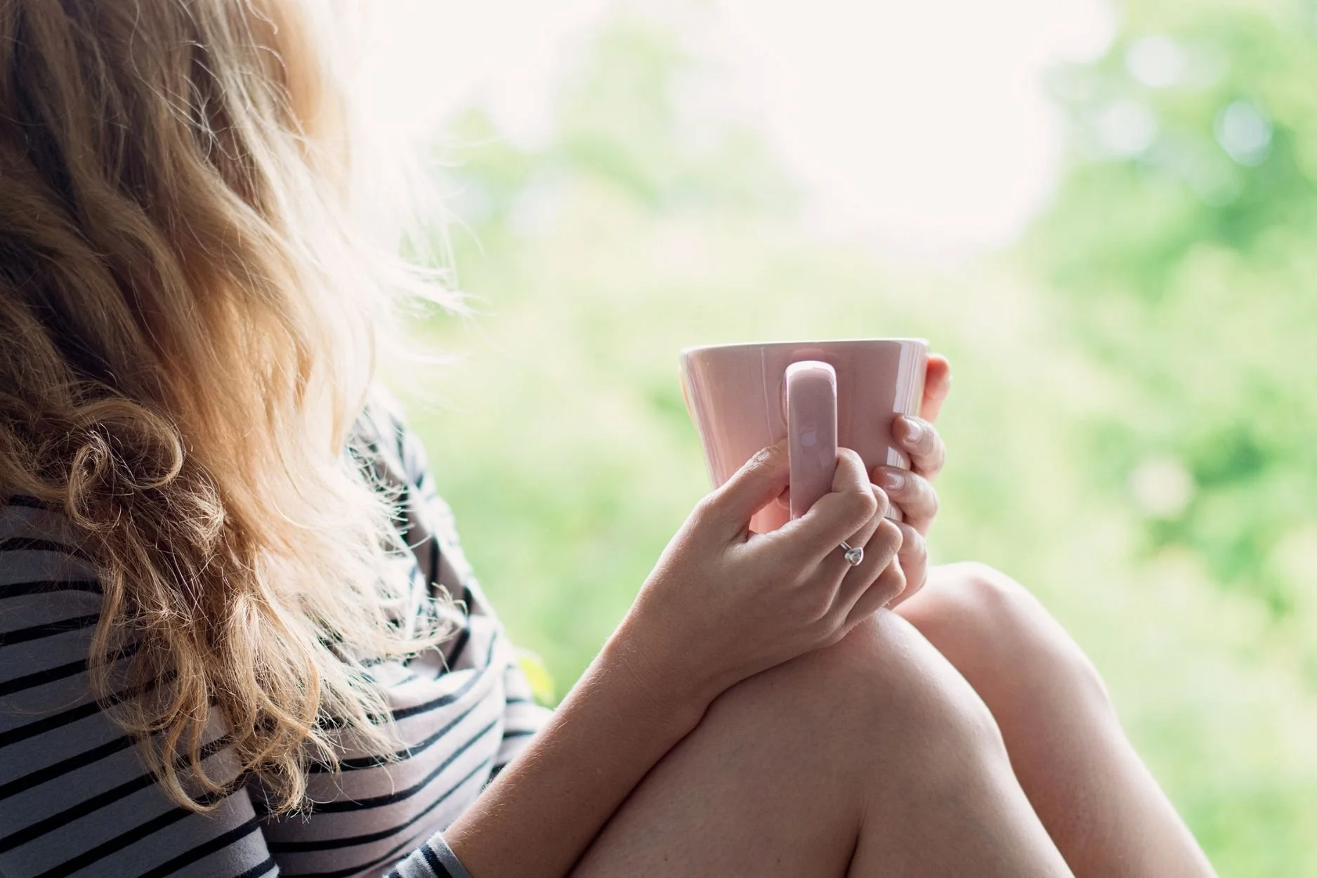 A person sipping coffee considering OCD Therapy in Toronto