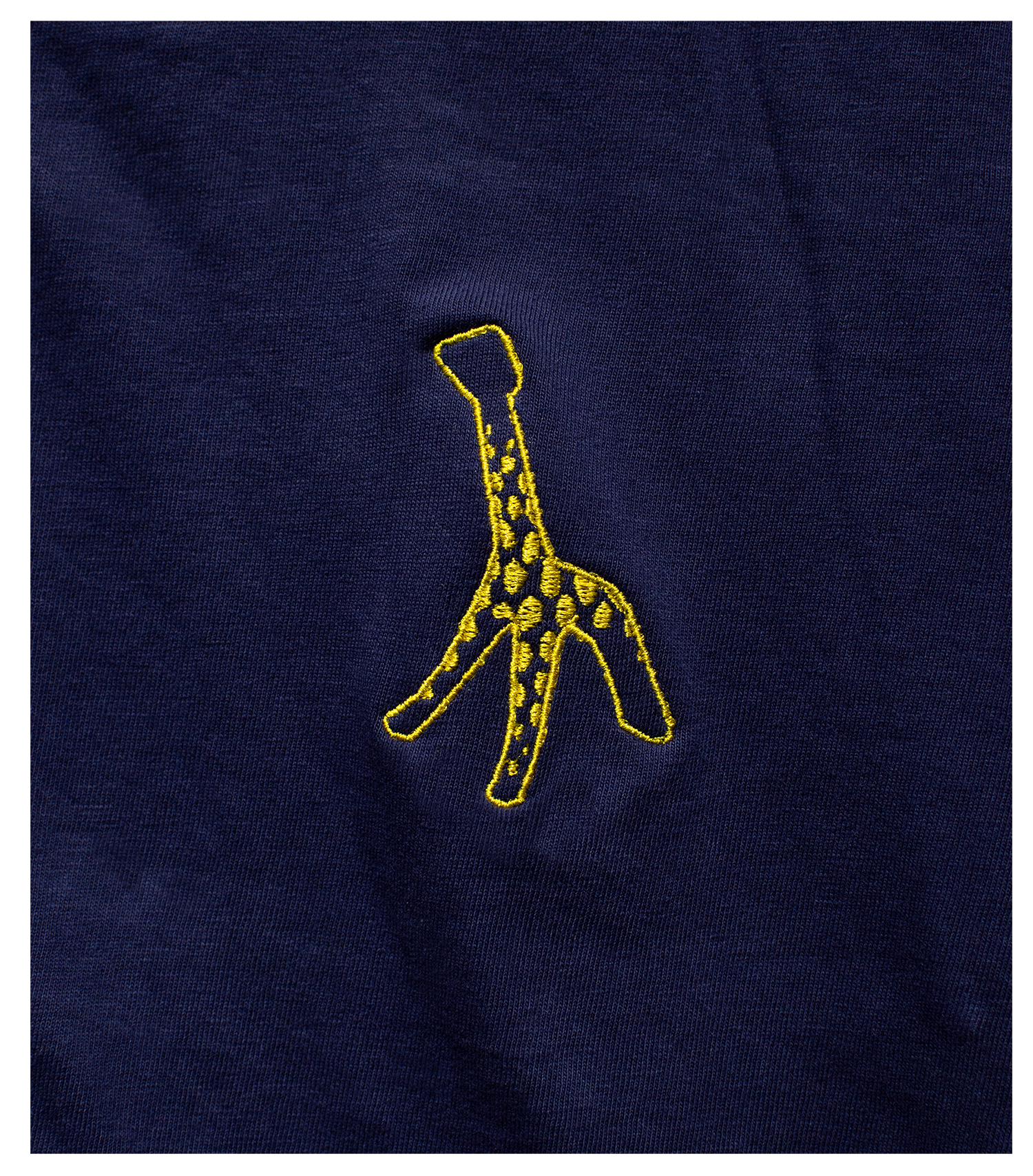 Detail of Washed Navy t-shirt with Marigold embroidered Giraffe on left chest