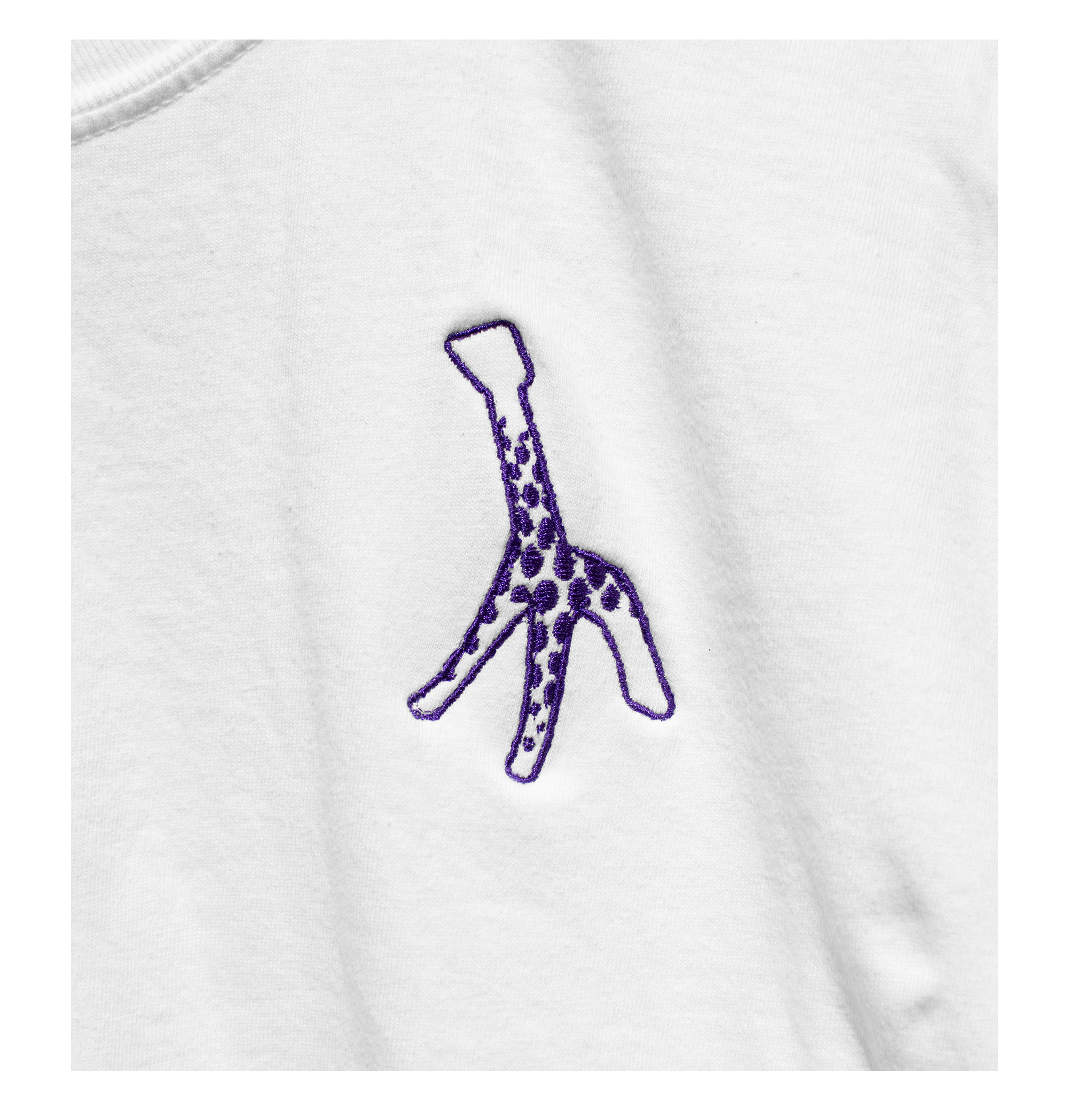 Detail of White t-shirt with purple embroidered Giraffe on left chest