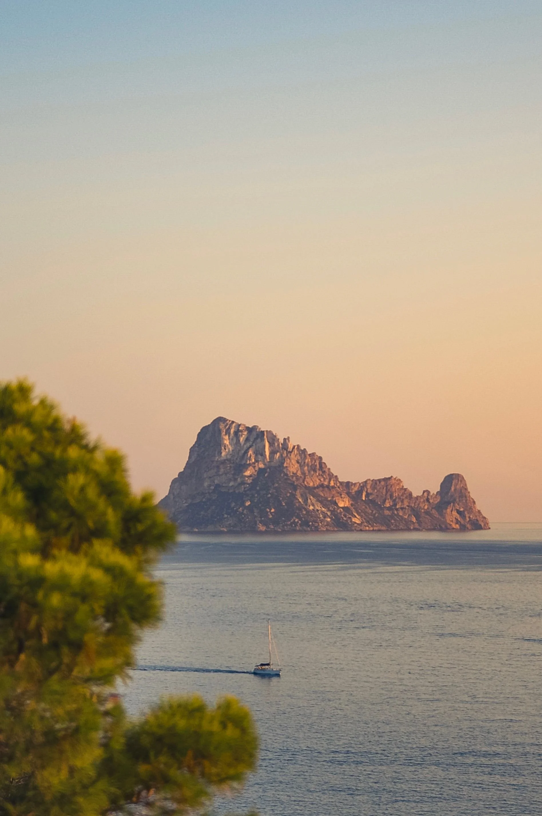 Private boat arriving at a remote shore during the full-day DXA Beyond experience.