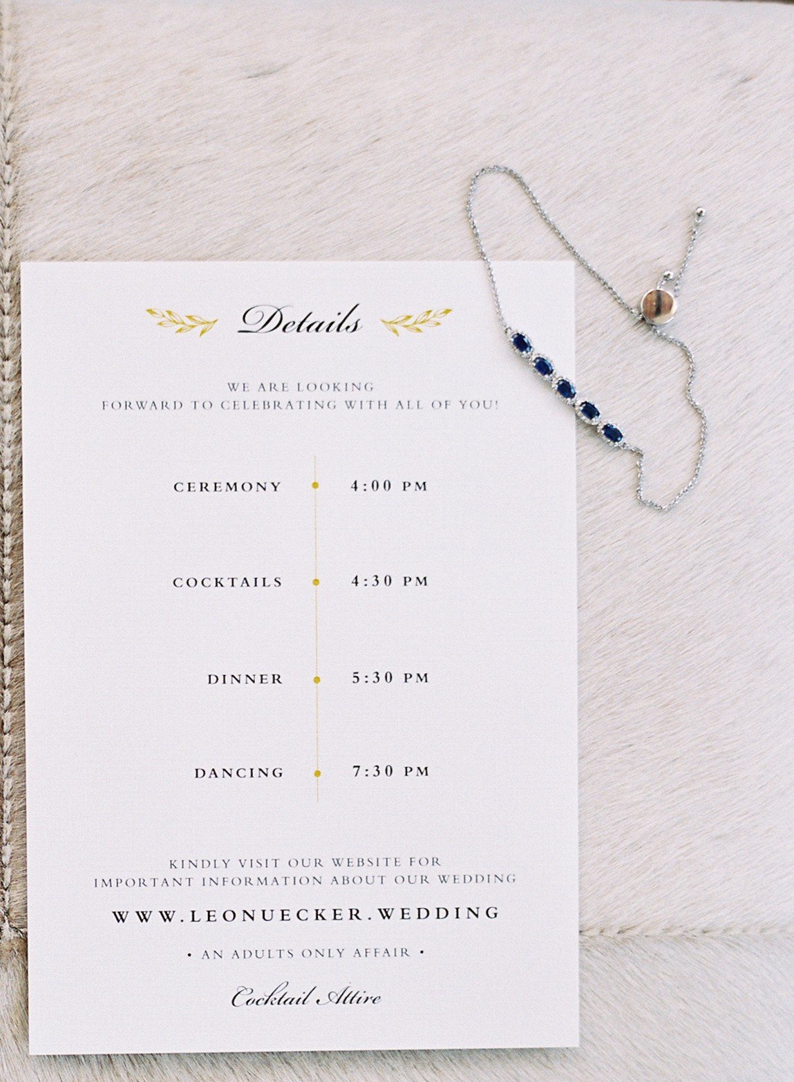 leafy-gold-monogram-black-white-wedding-invitation
