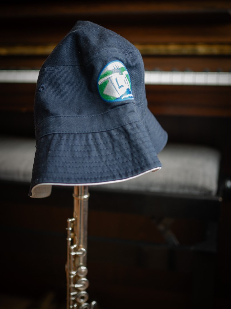 A flute wearing a sun hat - music teacher on holiday