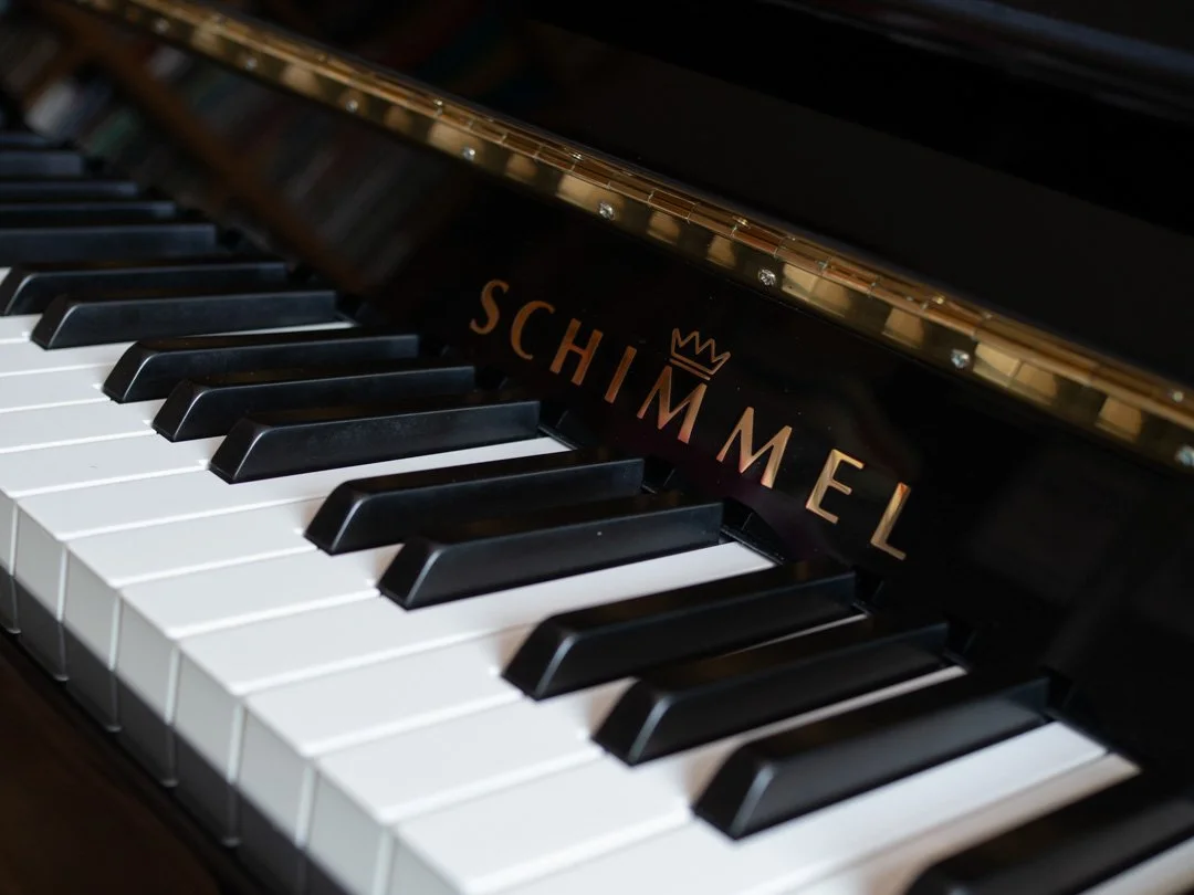 Close-up of a Schimmel upright piano keyboard