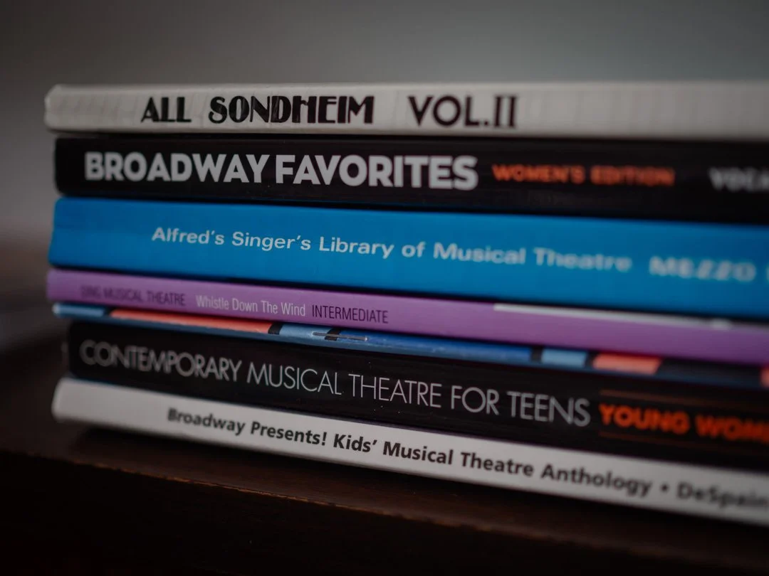 Collection of sheet music books for singers, an essential resource when following musical theatre audition tips.