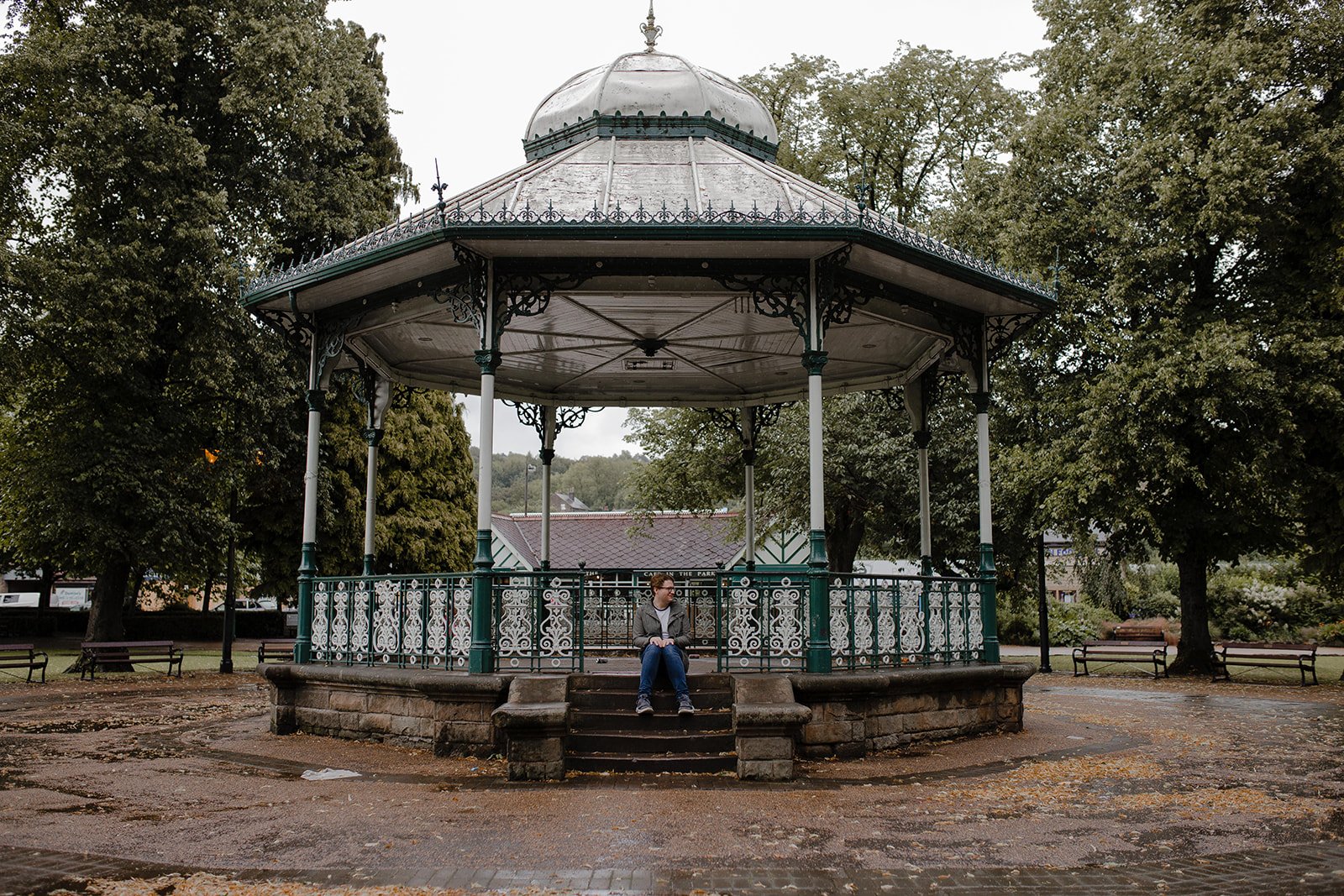 David Barton sitting on the steps of a bandstand in Matlock during a holiday, reflecting on rest and wellbeing as a music teacher.