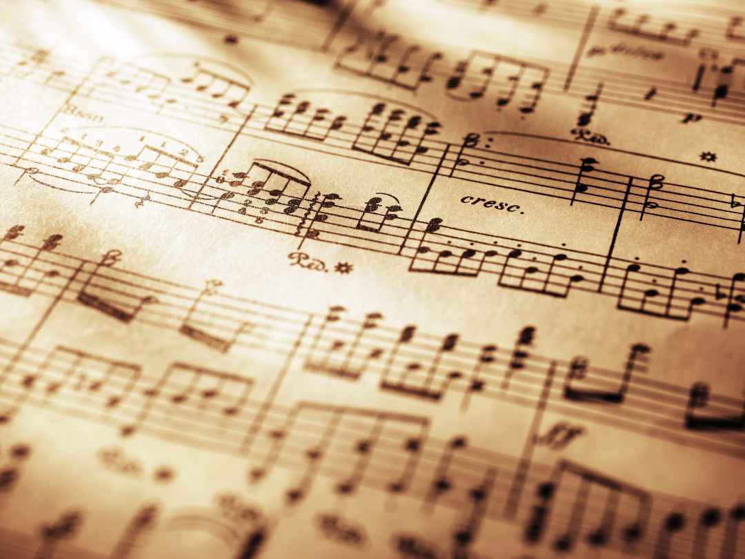 Soft rays of light falling across an open sheet of music, representing reflection and the beauty of learning to sight-read.
