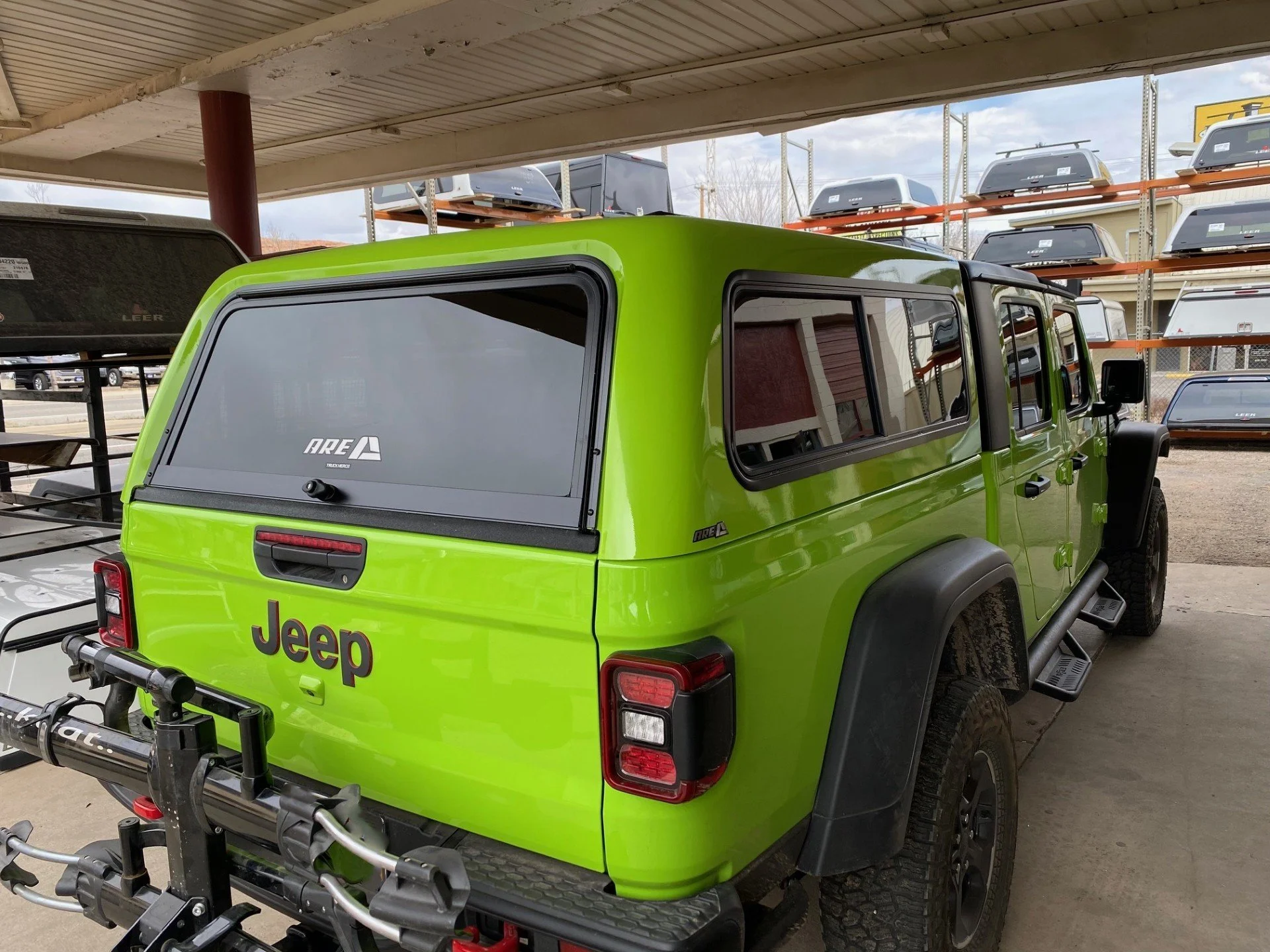 Jeep with ARE Shell and Rack.jpg