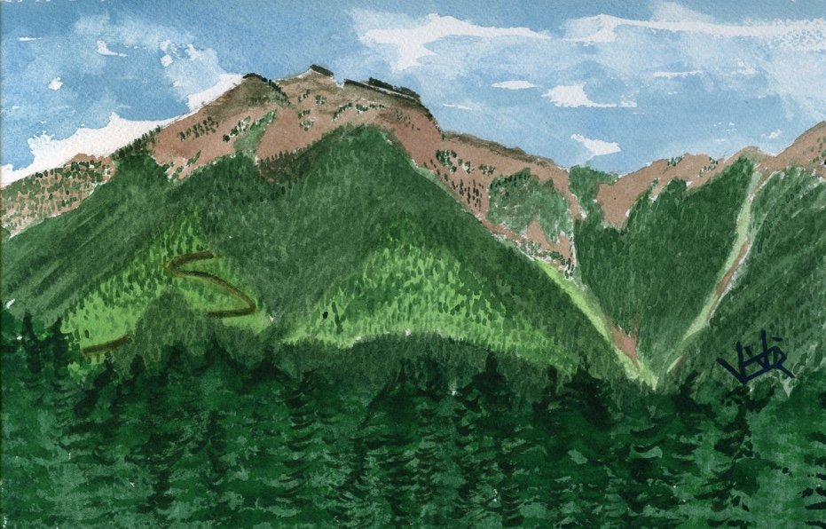 mountain shoulder with a switchback road on it