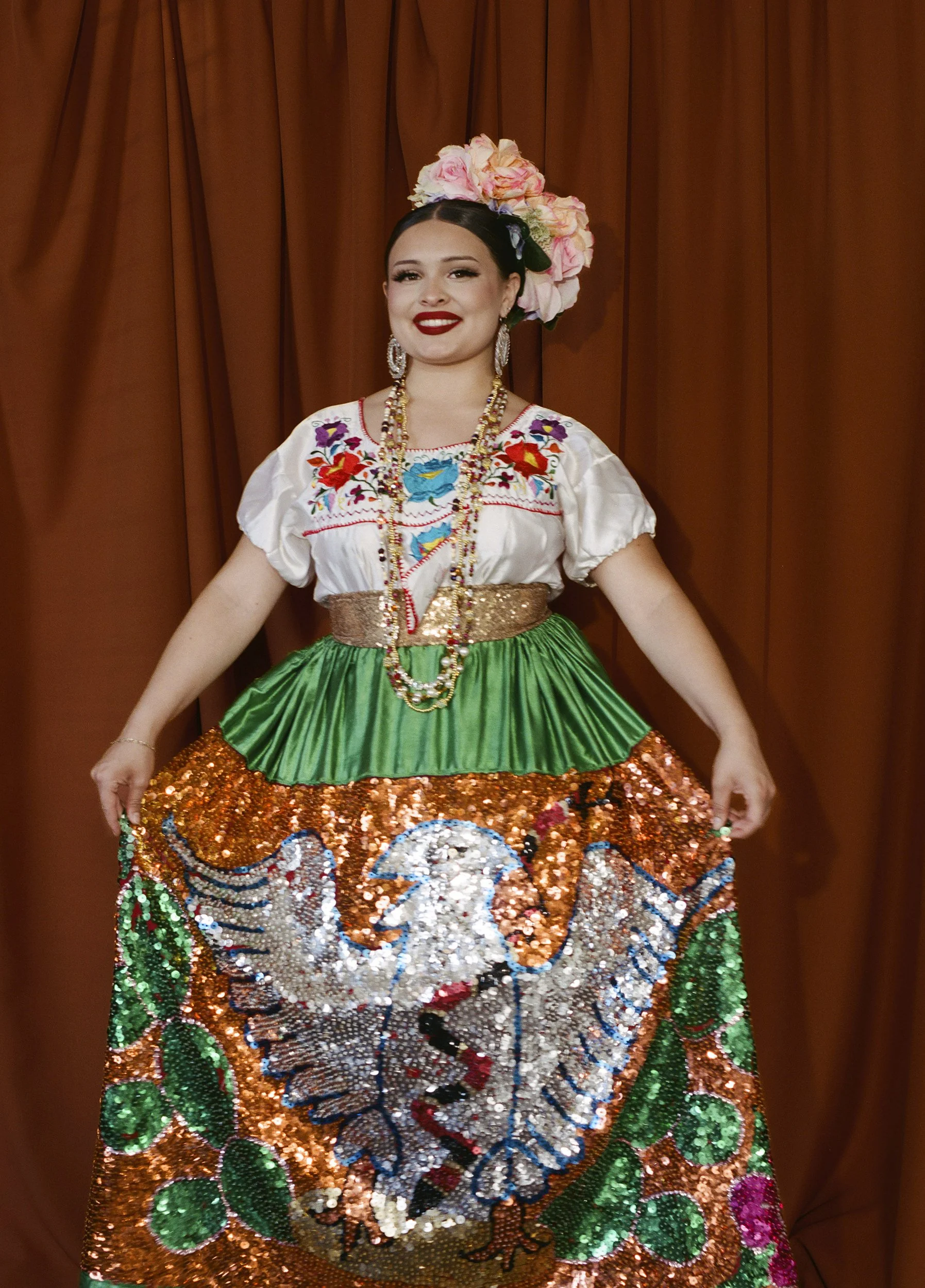 Daniella Padilla-Meraz, 2026
 
27½ x 19¾ inches 
 
 
First-generation folklorico dancer, member of Folklórico Revolución. 
 
 
“Folklorico means community and culture and the ability to share such a vibrant and embracing form of dance to others.”