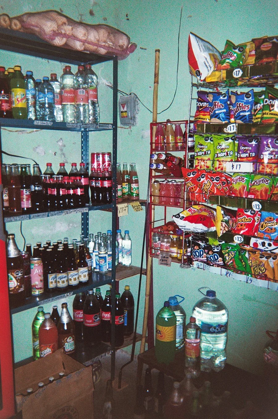  Coca-Cola , 2024, 35mm film (Inkjet print), 20 x 16 inches.
 
 
Mi mami casi no toma Coca, pero esta foto fue capturada en una tienda no muy lejos de la casa de mis abuelos. A veces me pongo a pensar en qué tan diferente seria mi vida si mis abuelos