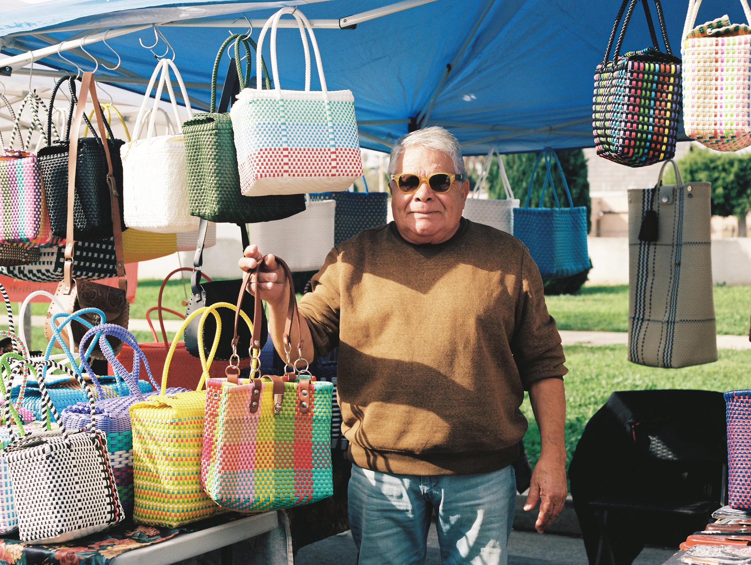  Wellington Heights Farmers Market , 2026, Medium format film, 16x20 inches
 
 
Vendors gather every Sunday morning to prepare their tables for incoming customers at the Wellington Heights Farmers Market. 