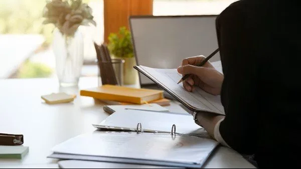 Nurse Consultant analyzing charts