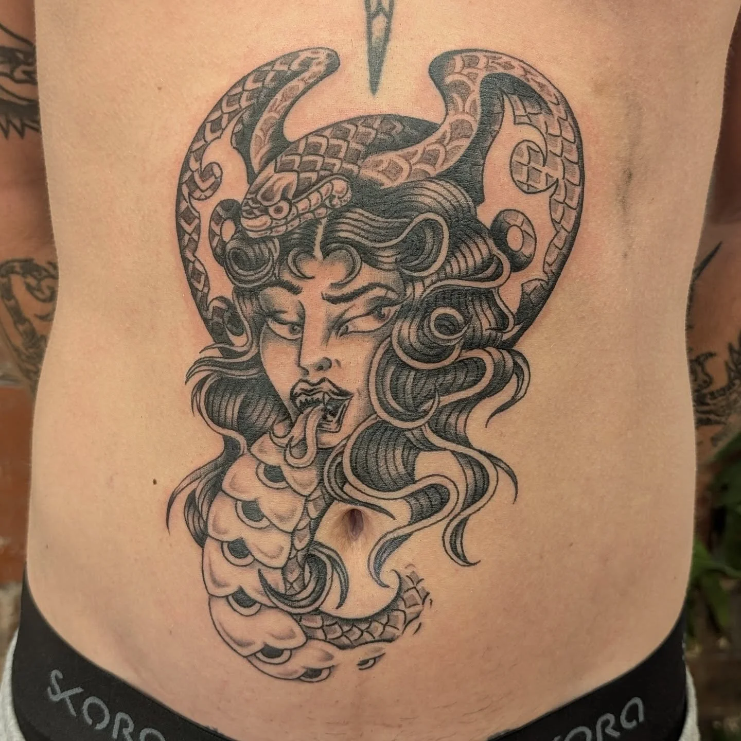 Massive shoutout to @noahhdixonn for picking this design and putting it in the coolest spot, cheers mate! Designed as a one-off, but if you like it, I can whip up something similar, hit me up in the DMs.

#tattoo #snake #girl #cobra #stomachtattoo