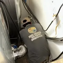 Technician with Four Seasons service a dryer vent. Ready to service Bellevue, Edmonds, Issaquah, Redmond, Lynnwood, Mountlake Terrace, Mill Creek, Bothell, Mercer Island, Brier, Kenmore, Woodinville, Duvall, Lake Stevens and Seattle.