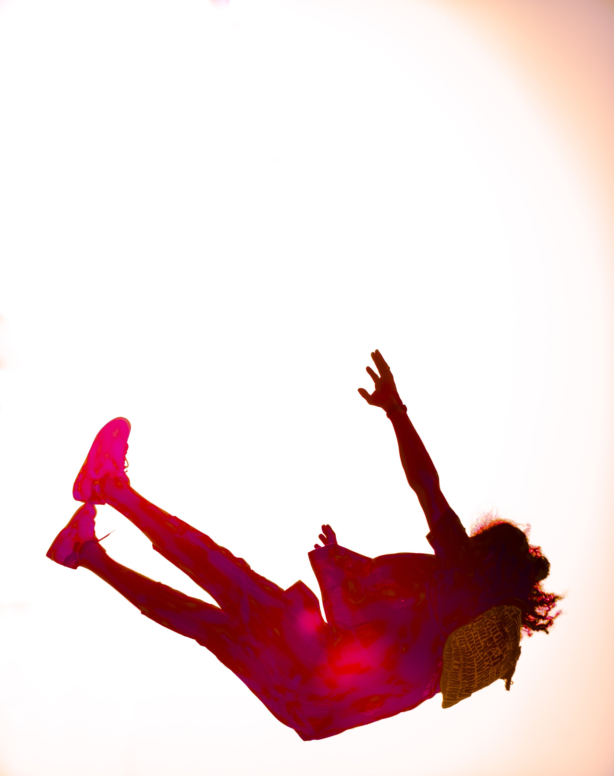 Person falling through the air, reaching towards sky, with a backpack, against a white background.