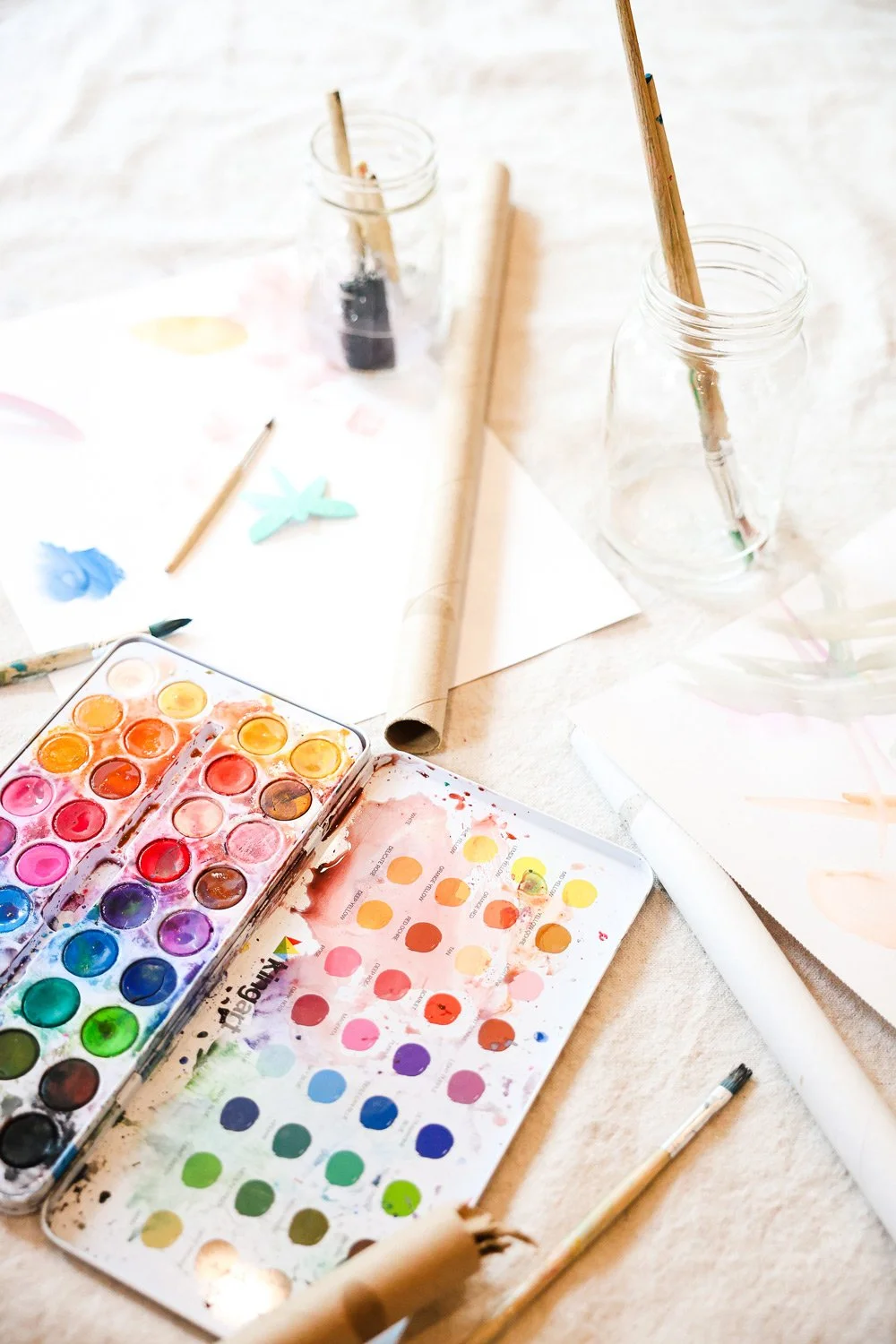 Art materials and watercolor palettes used for Shine’s outreach and school art programs.