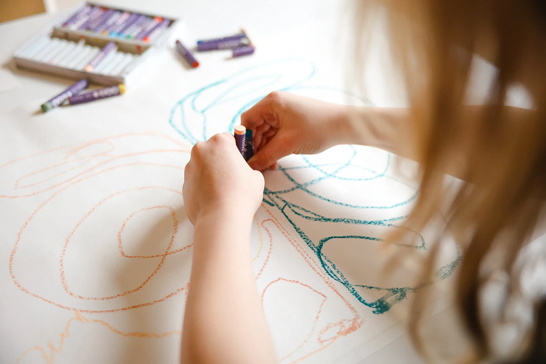 Child creating expressive artwork during Little Makers art class at Shine Art Studio in Edmonton.