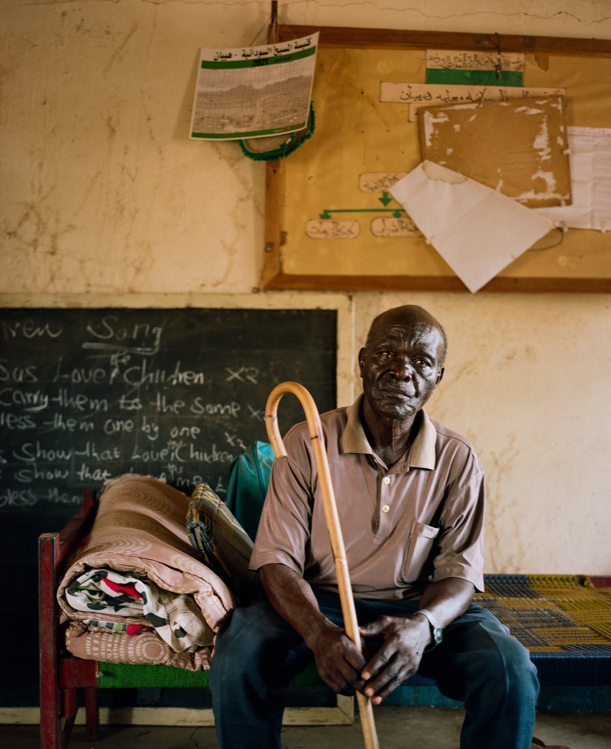 Hassan Kundakuku sits for a portrait during a trauma healing workshop.