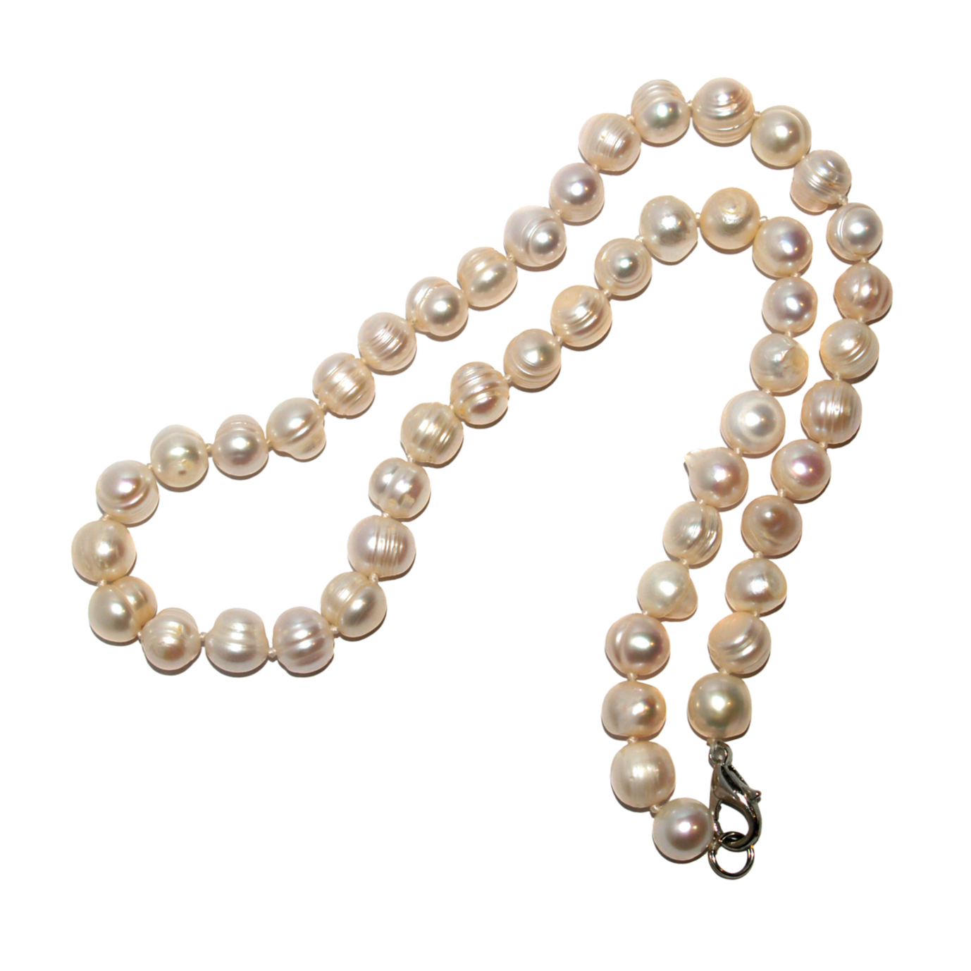 A string of white pearl necklaces with a pearl clasp, arranged in a loose croissant shape.