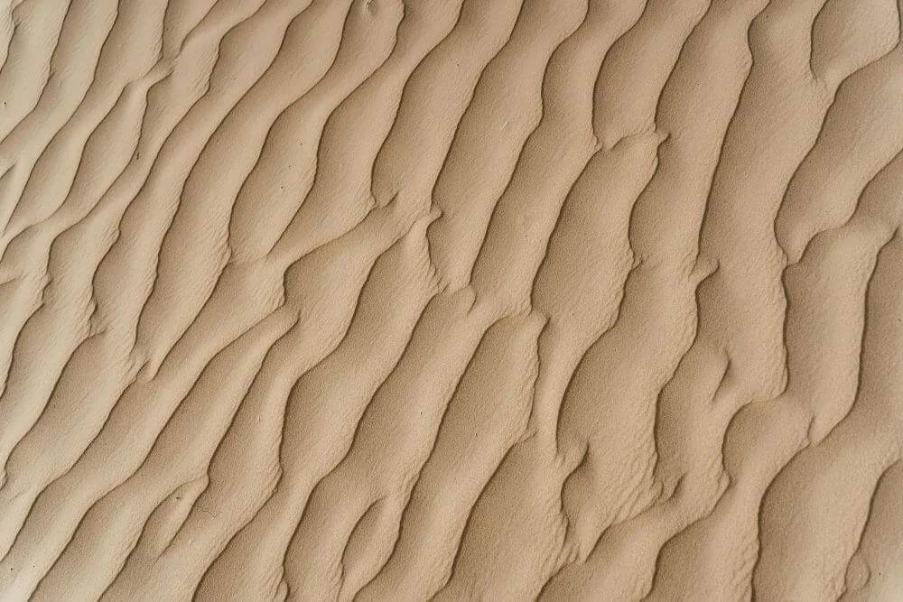 Sand pattern representing Lyrical, the rhythm of lightness, creativity, play and joyful self-expression