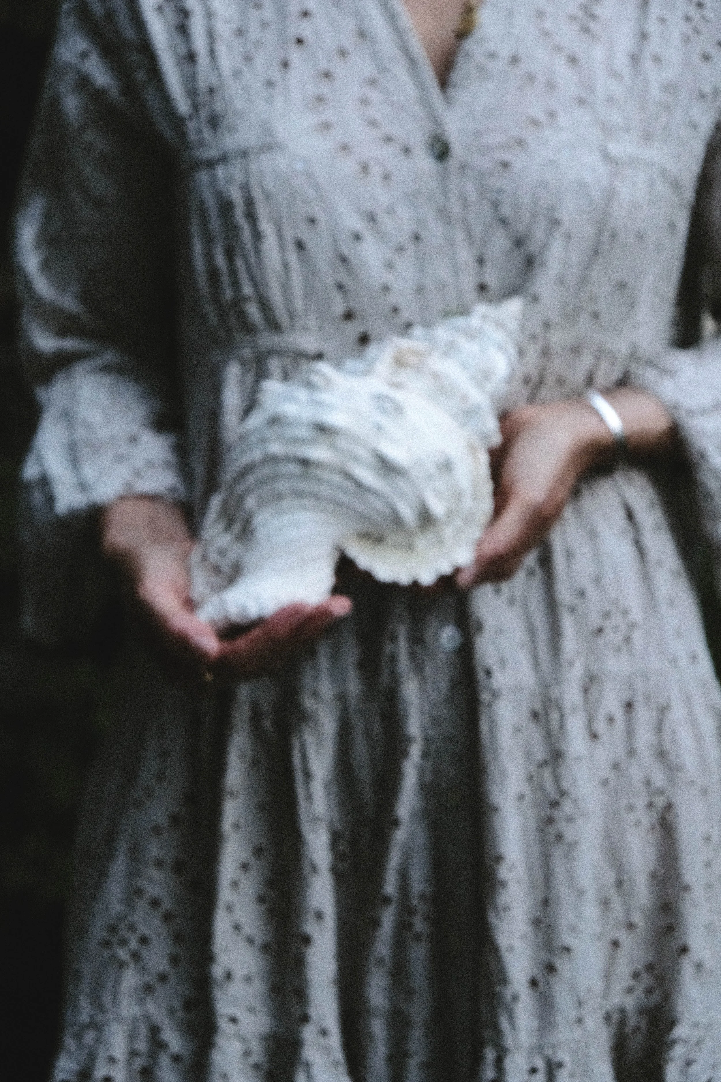 venusian-getaway-conch-shell-feminine-ritual-hands.jpg