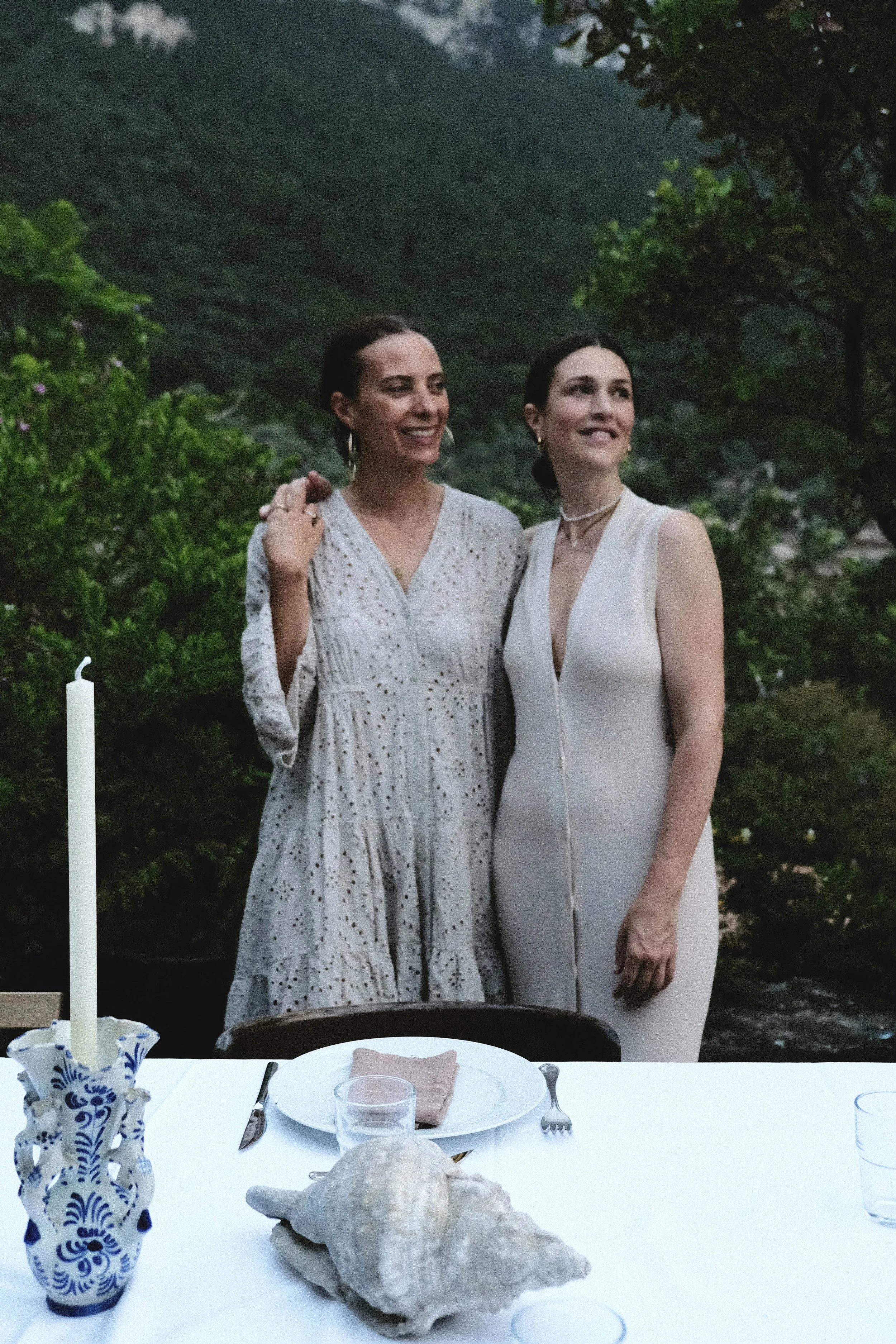 venusian-getaway-hosts-portrait-outdoor-dinner-garden.jpg