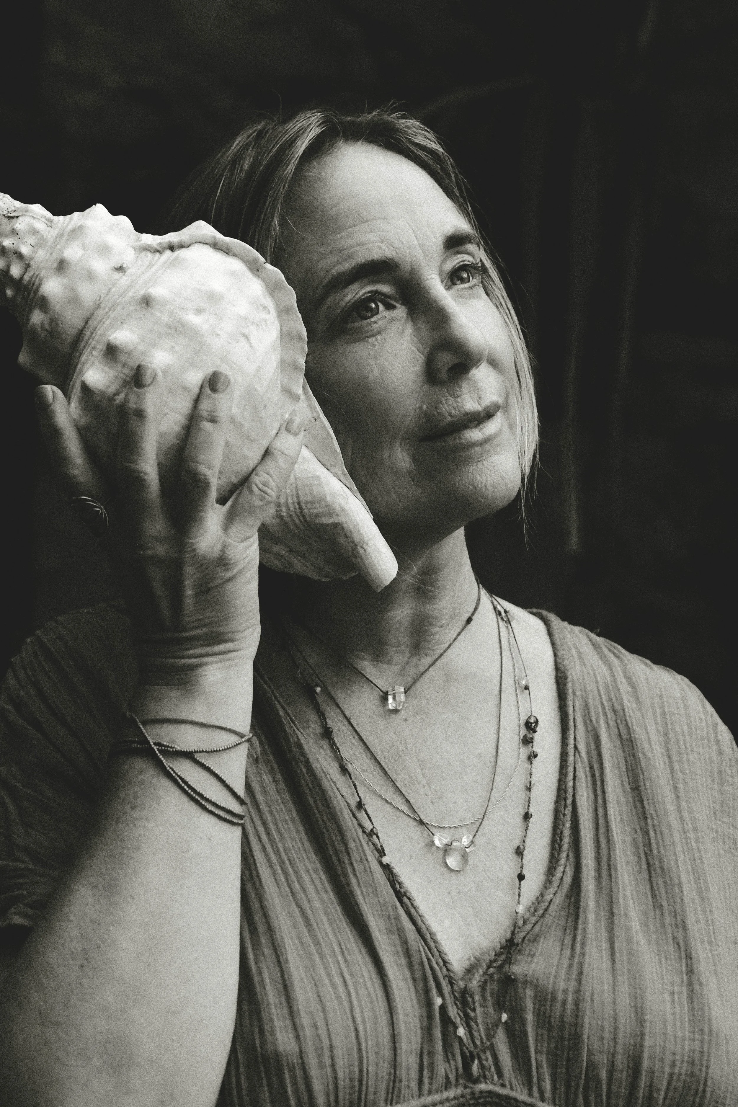 venusian-getaway-woman-conch-shell-listening-bw.jpg