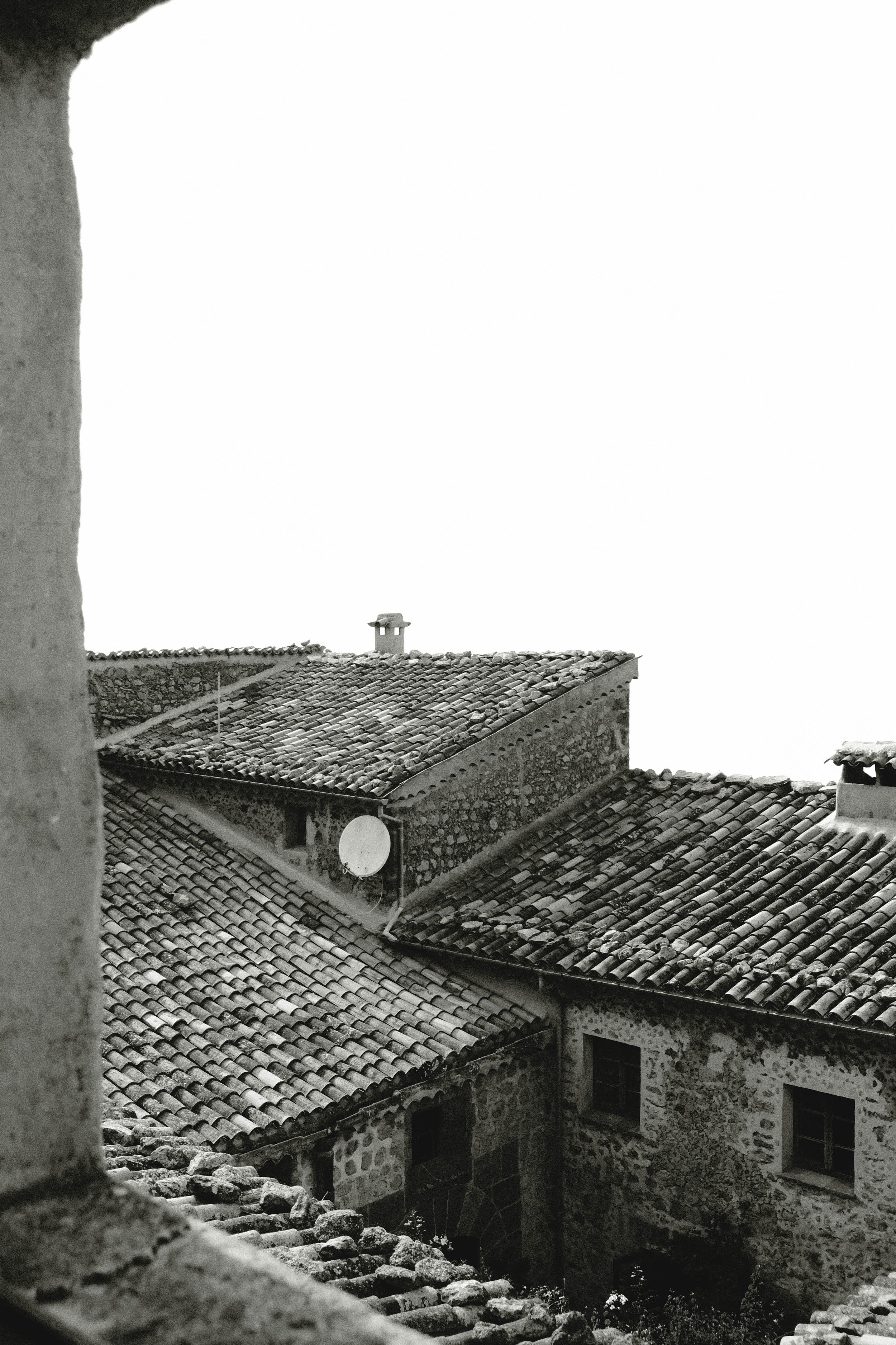 deia-monastery-stone-rooftops-archway-bw.jpg