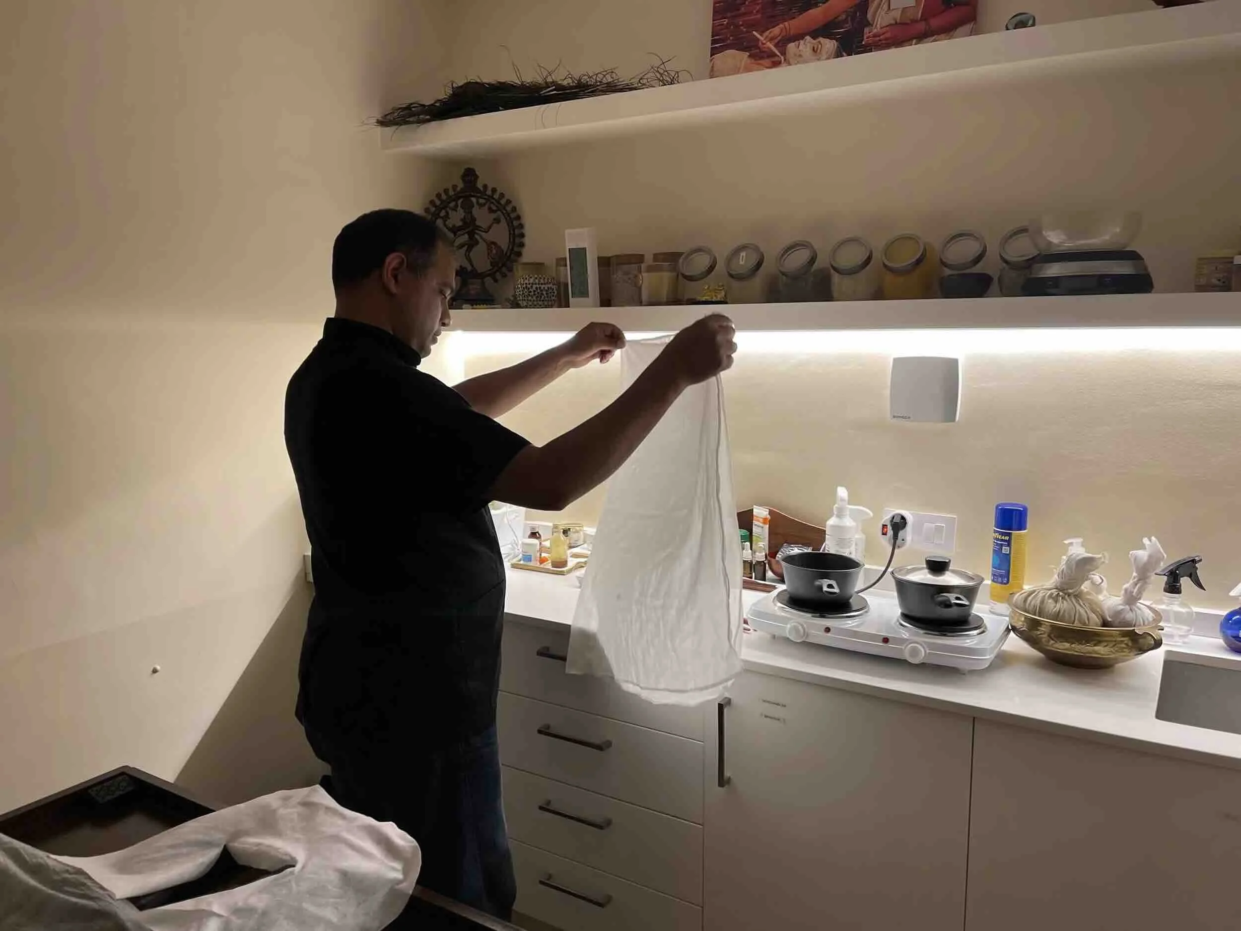 Dr. Narayan preparing herbal pindas for treatment