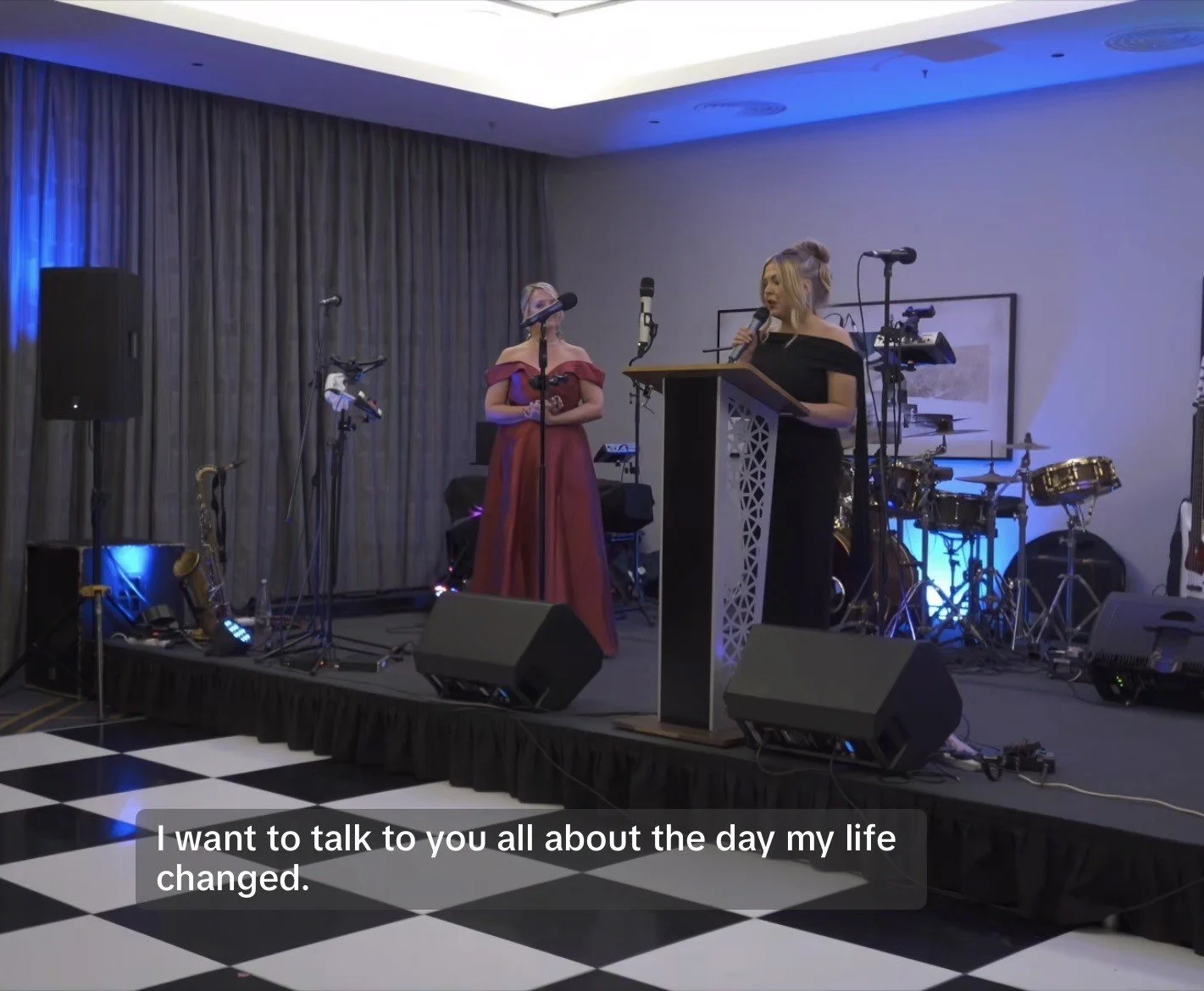 Hollie, the CEO, giving a talk on a stage holding a microphone with the caption saying 'I want to talk to you all about the day my life changed' showing that she would like to give involved in spokesperson roles.