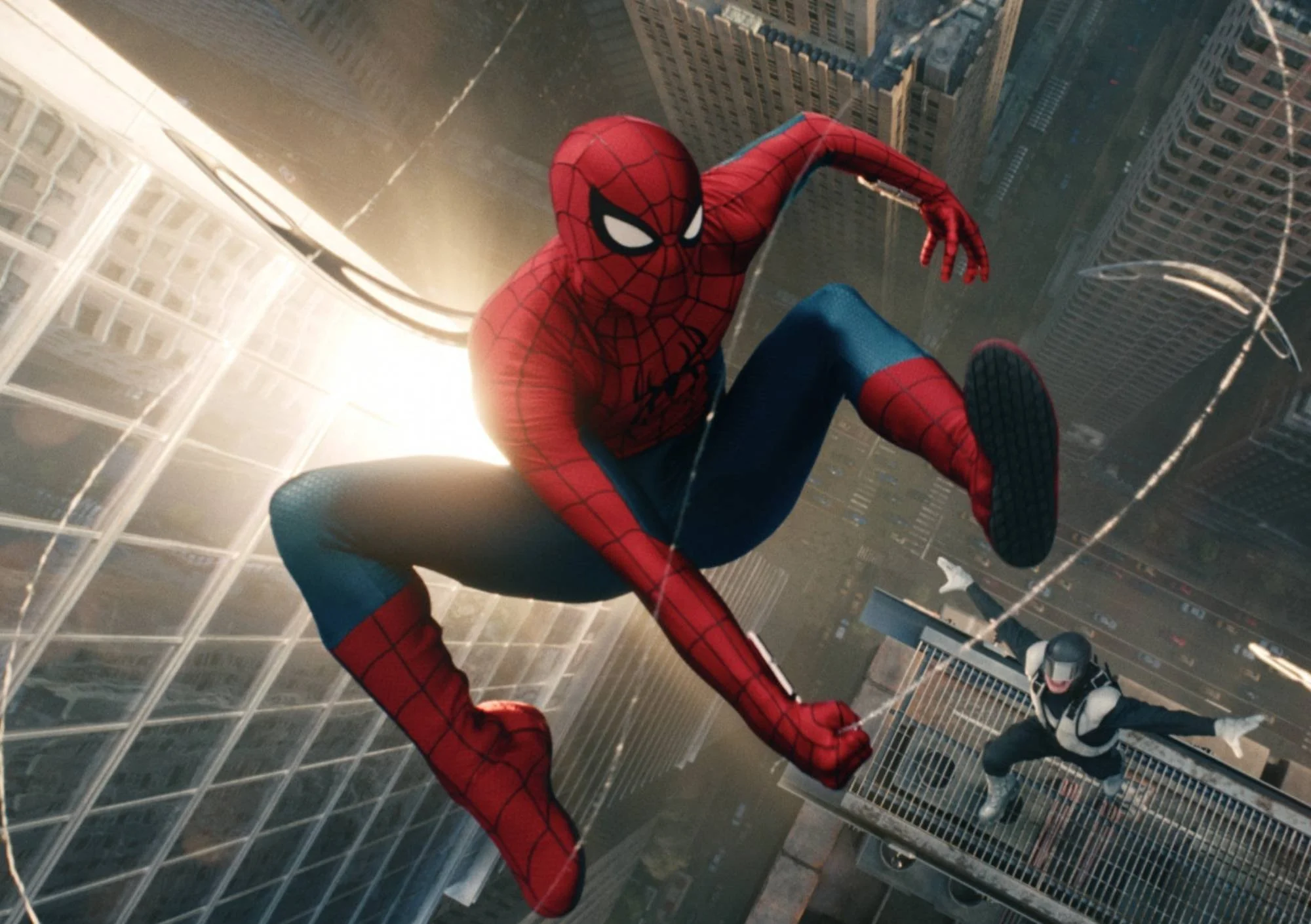 spider-man is swinging through the city