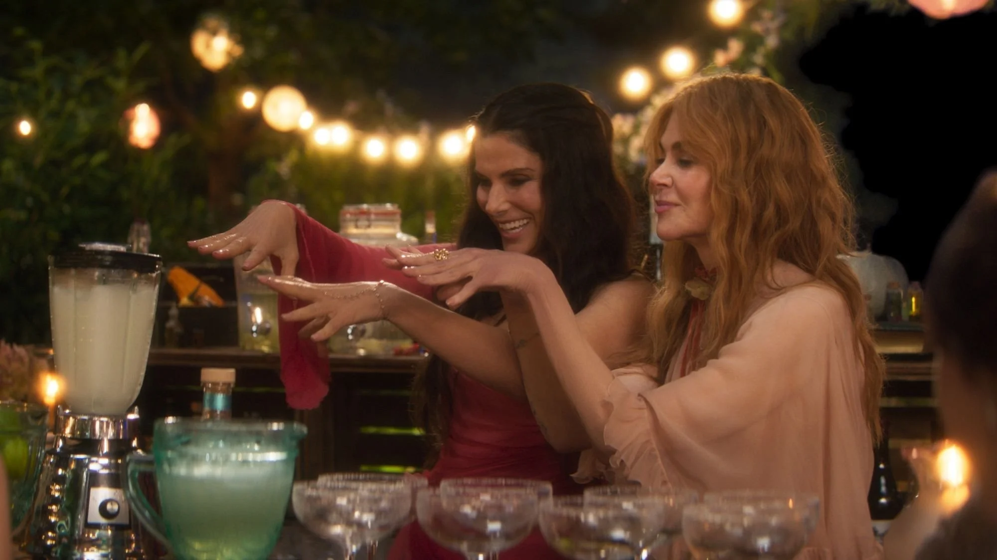 the practical magic sisters are smiling and using their magic to make some midnight margaritas