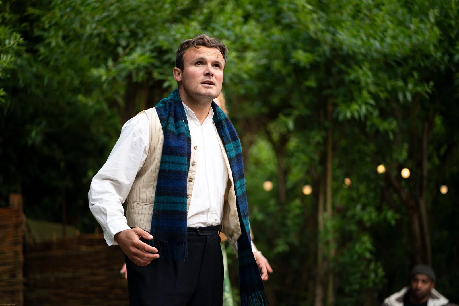 image shows man outside in a forest