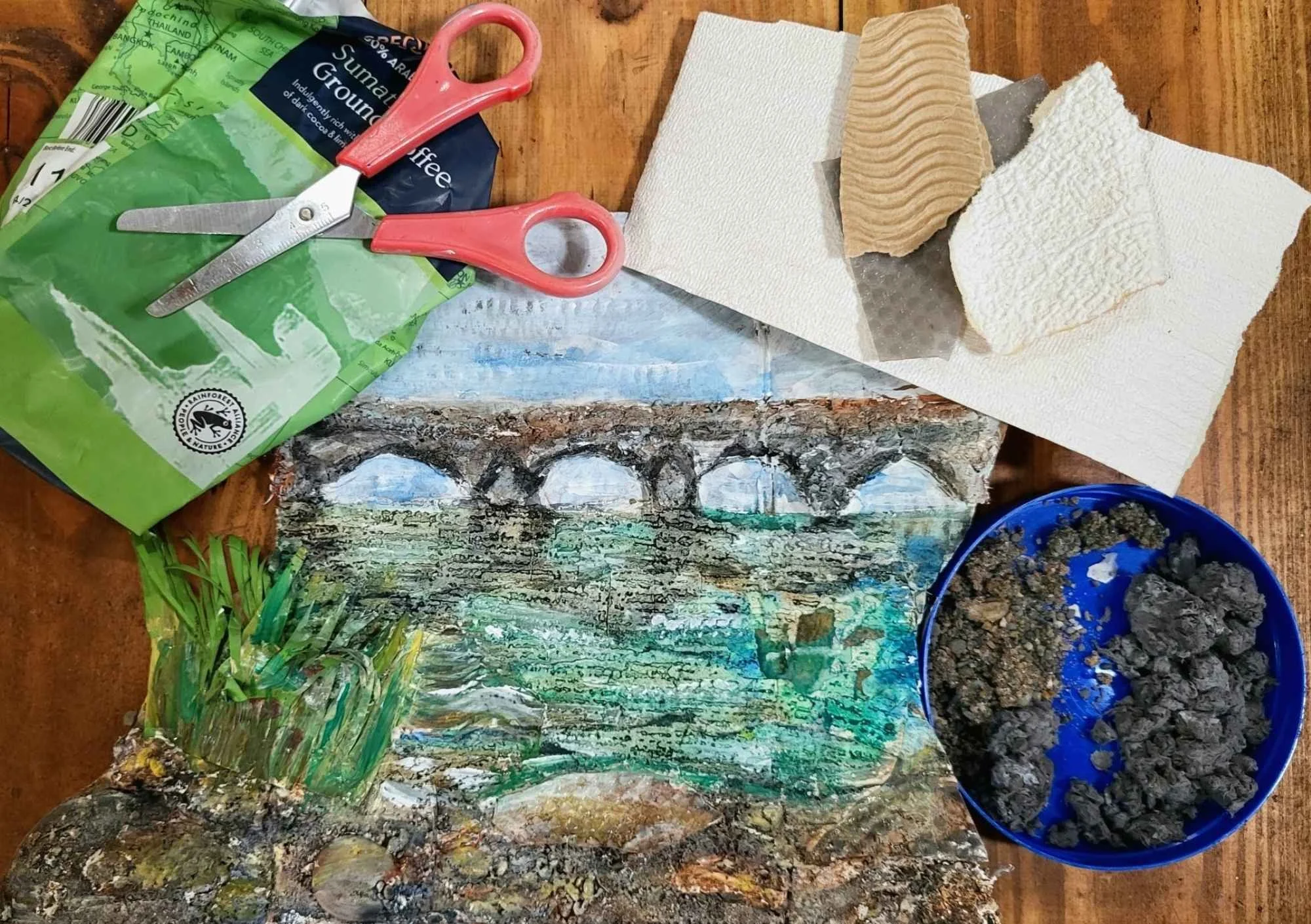 3D river art work surrounded by materials